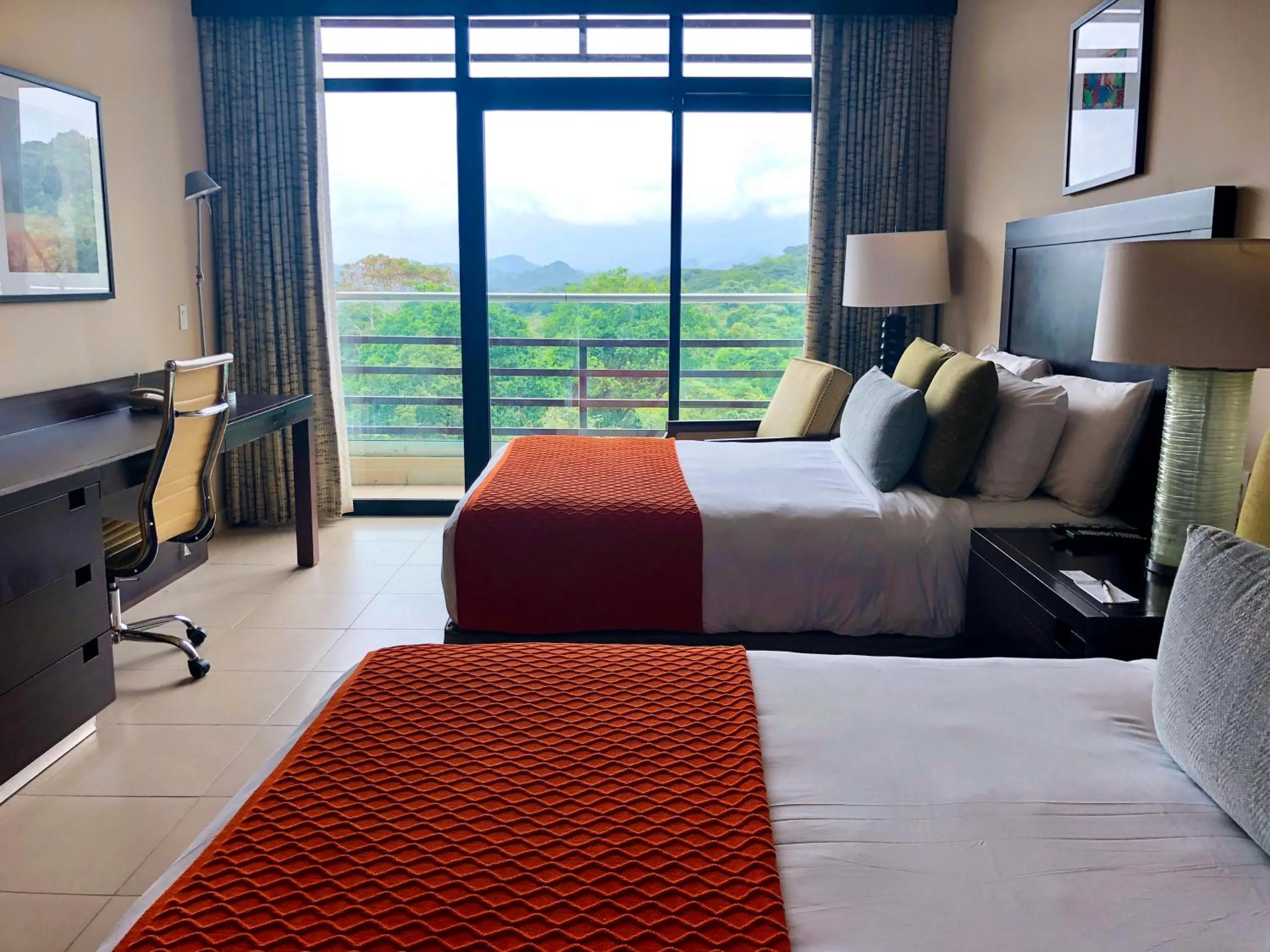 Bed in Summit Rainforest Golf Resort & All Inclusive