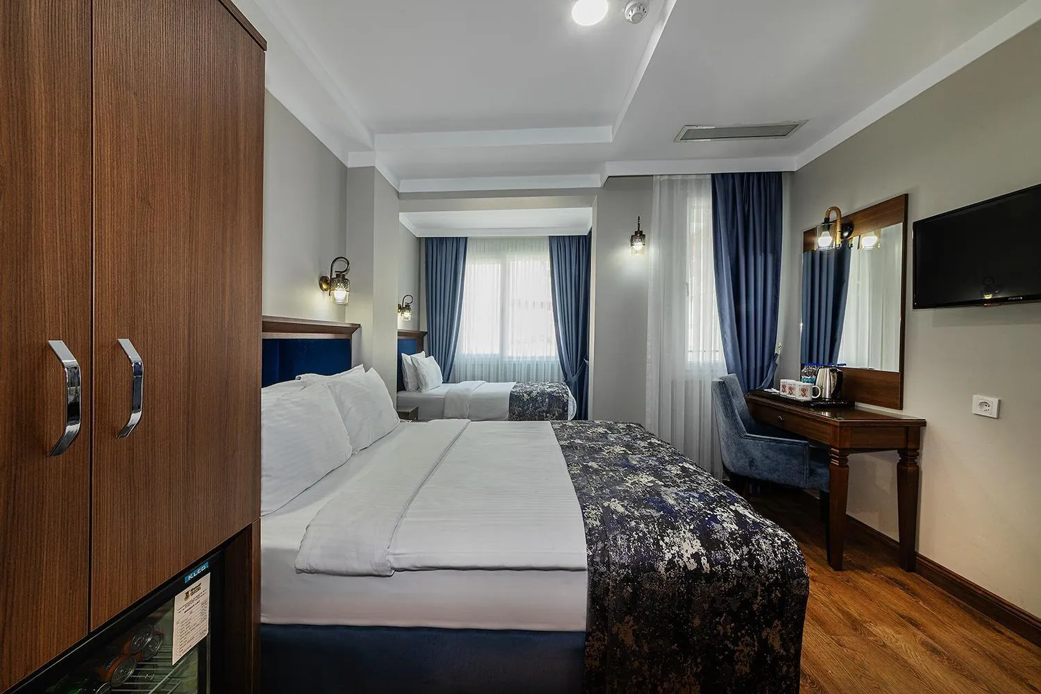 Bed in Aristocrat Hotel