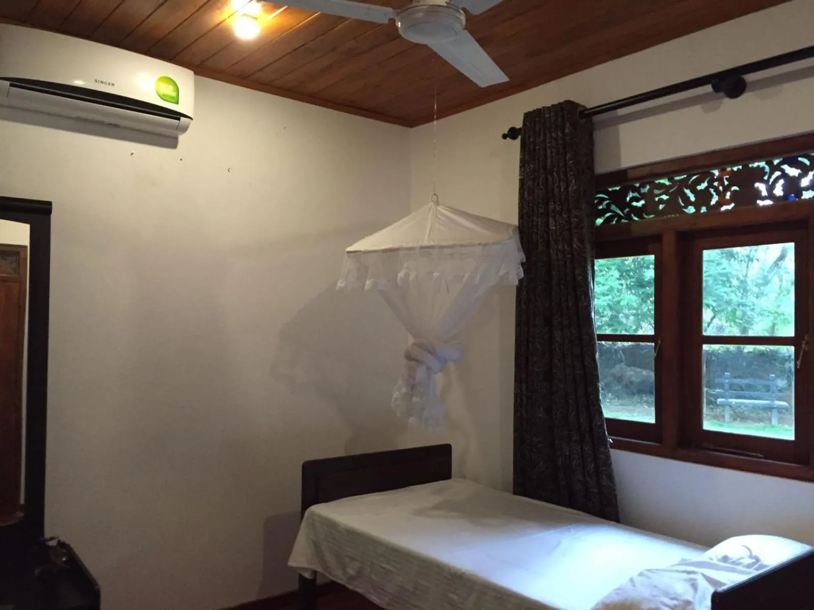 Bed in Green Herbal Ayurvedic Eco-Lodge