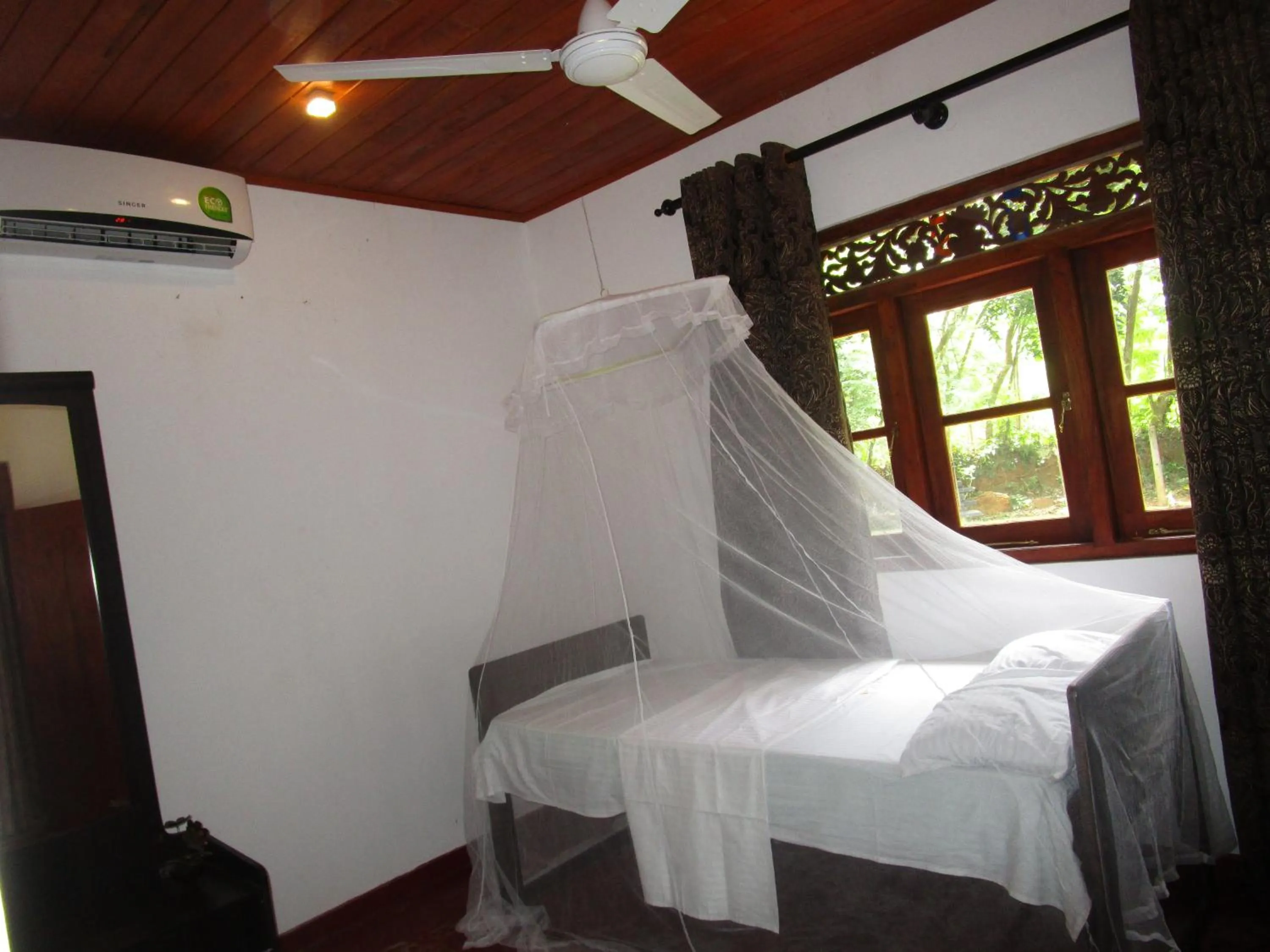 Bed in Green Herbal Ayurvedic Eco-Lodge