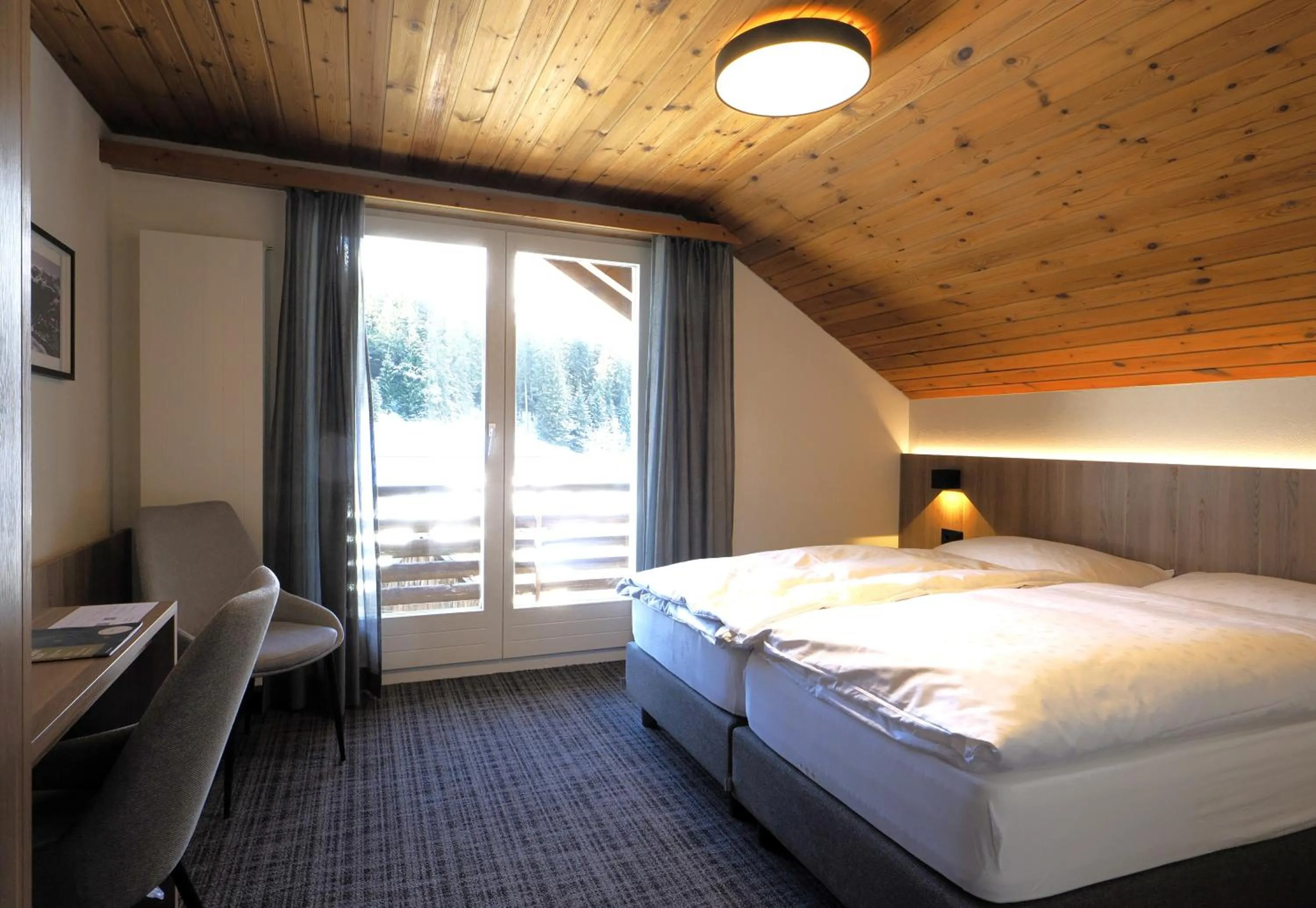Photo of the whole room, Bed in Hotel Alpina Parpan