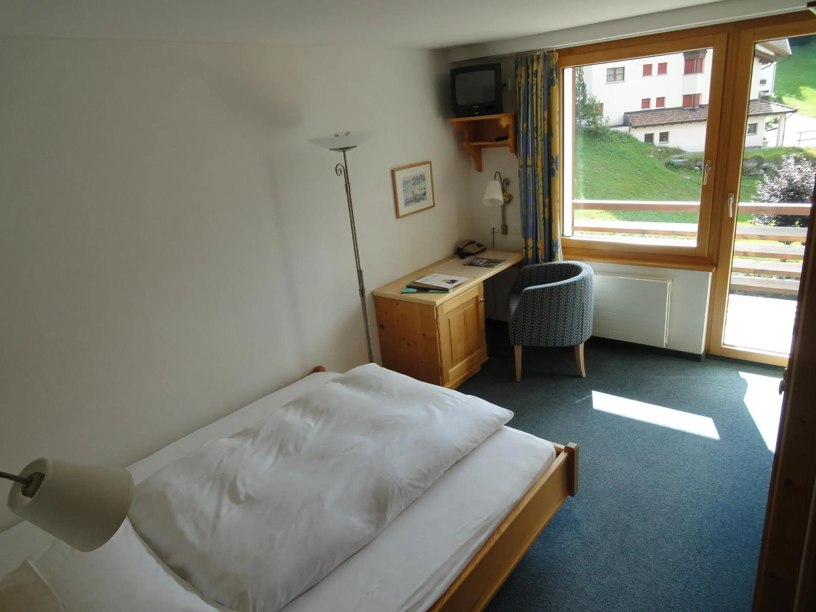 Toilet, Bed in Hotel Alpina Parpan