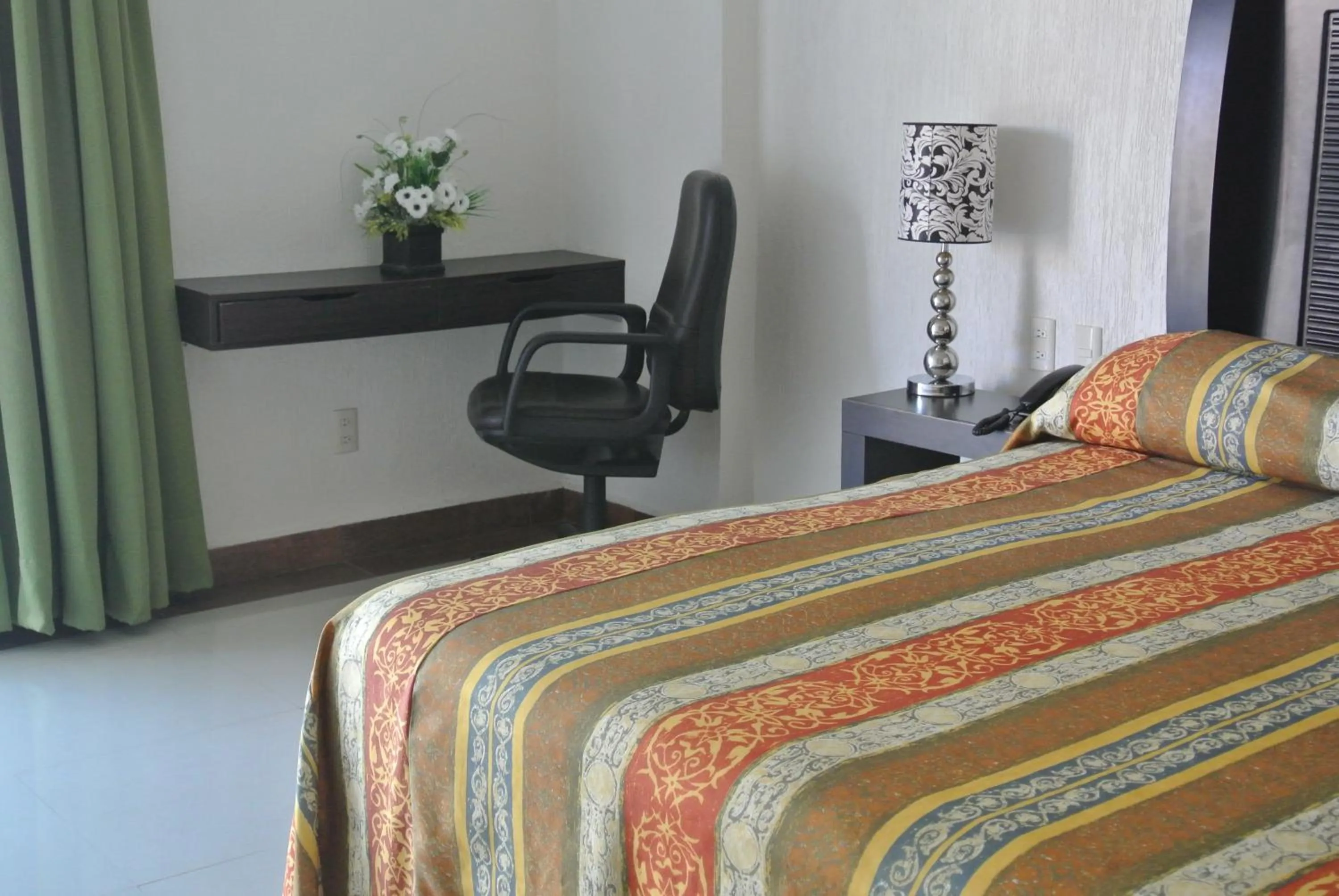Bed in Parque Inn Hotel & Suites