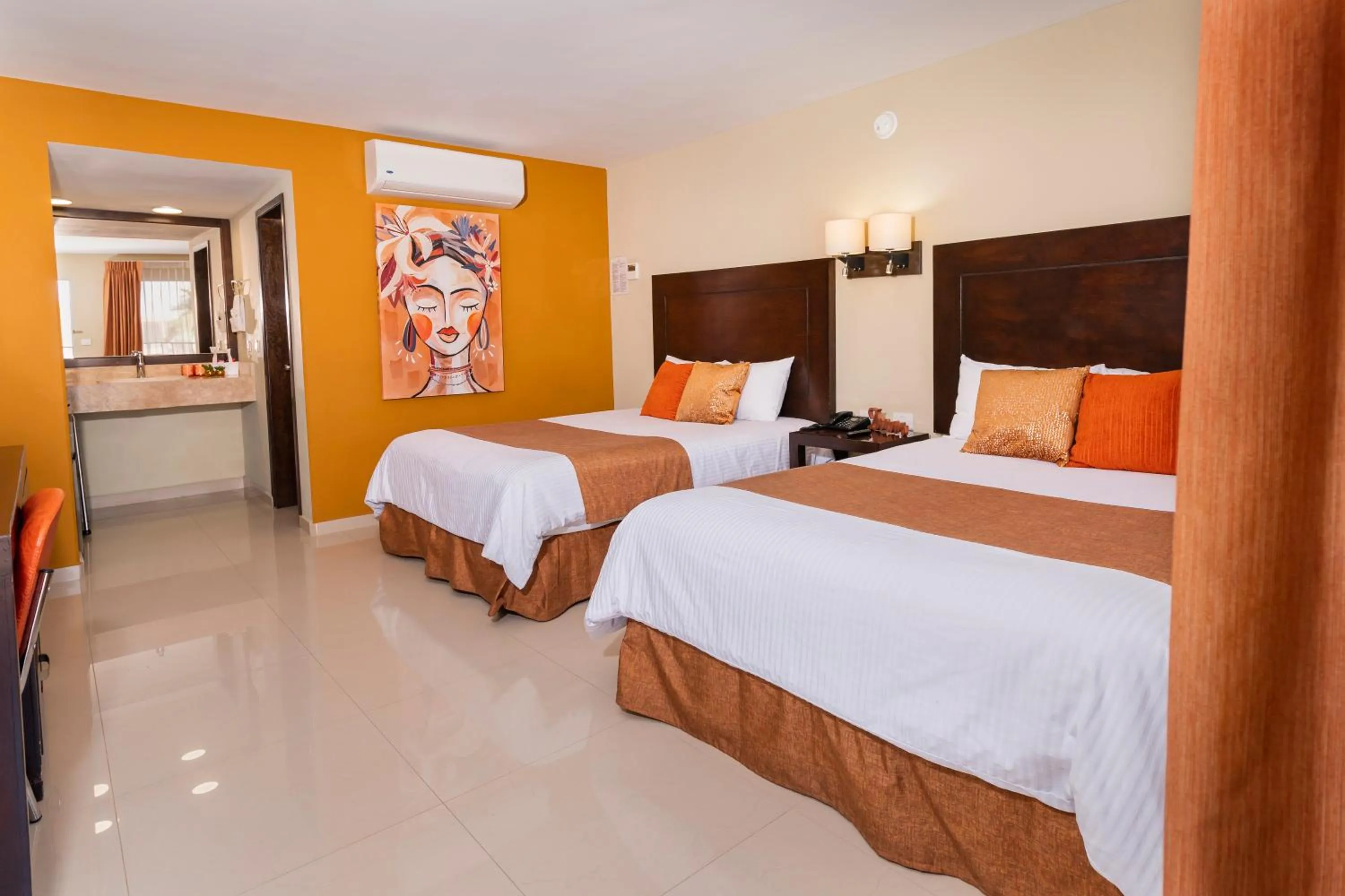 Bed in El Camino Hotel & Suites