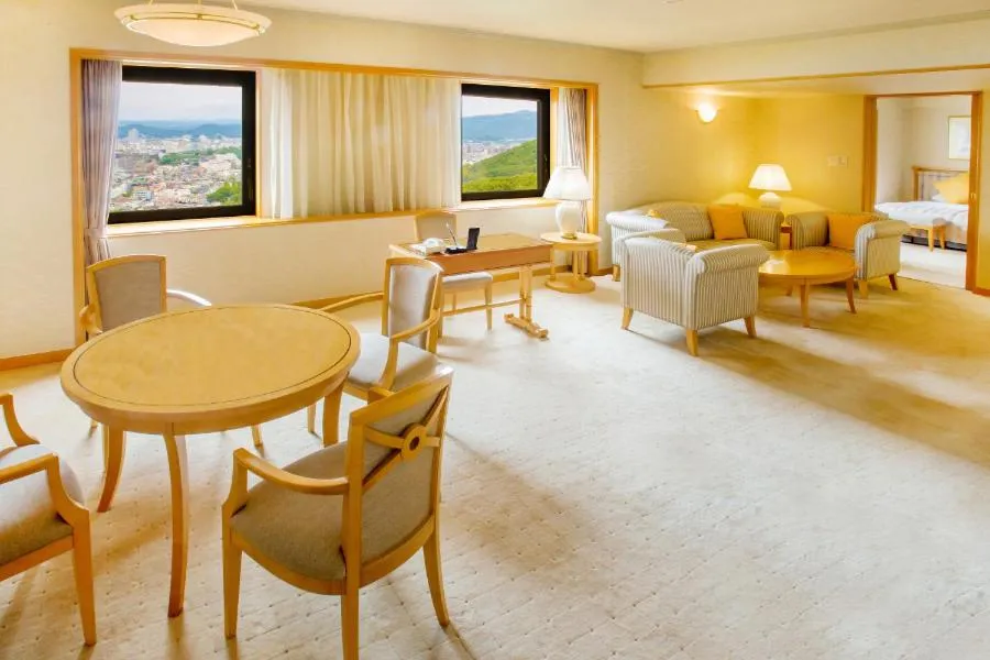 Living room, Bed in Okayama International Hotel