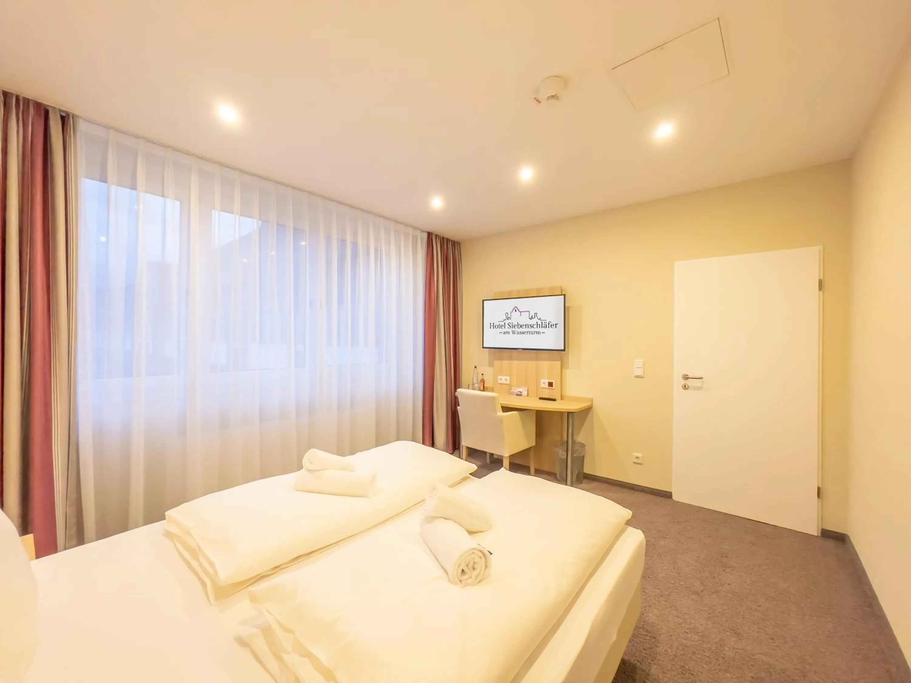 Bed in Hotel Siebenschläfer am Wasserturm