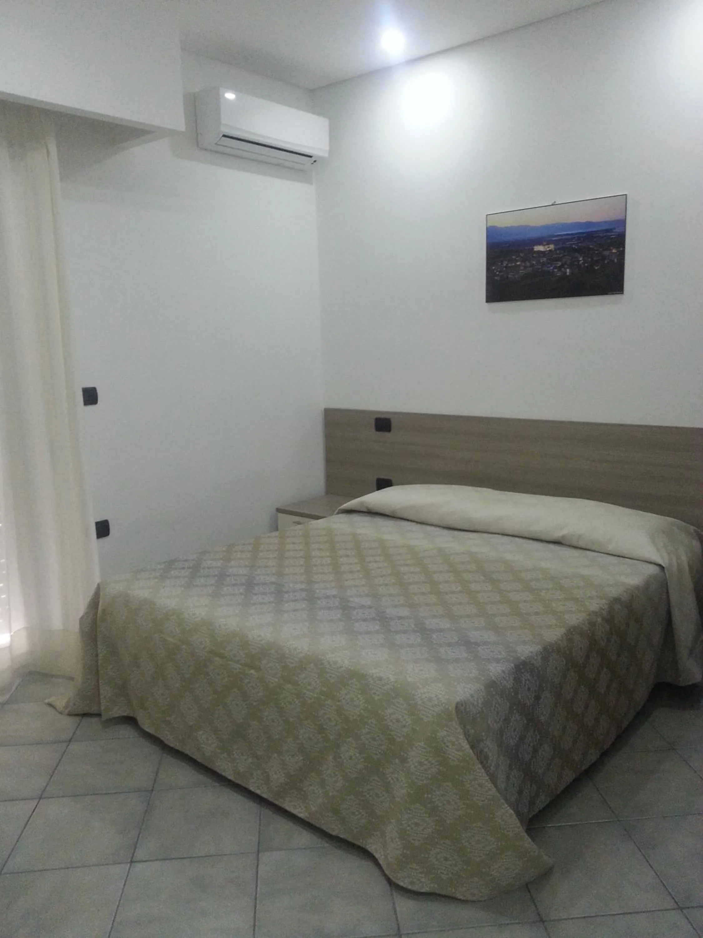 Bed in Hotel Poseidon