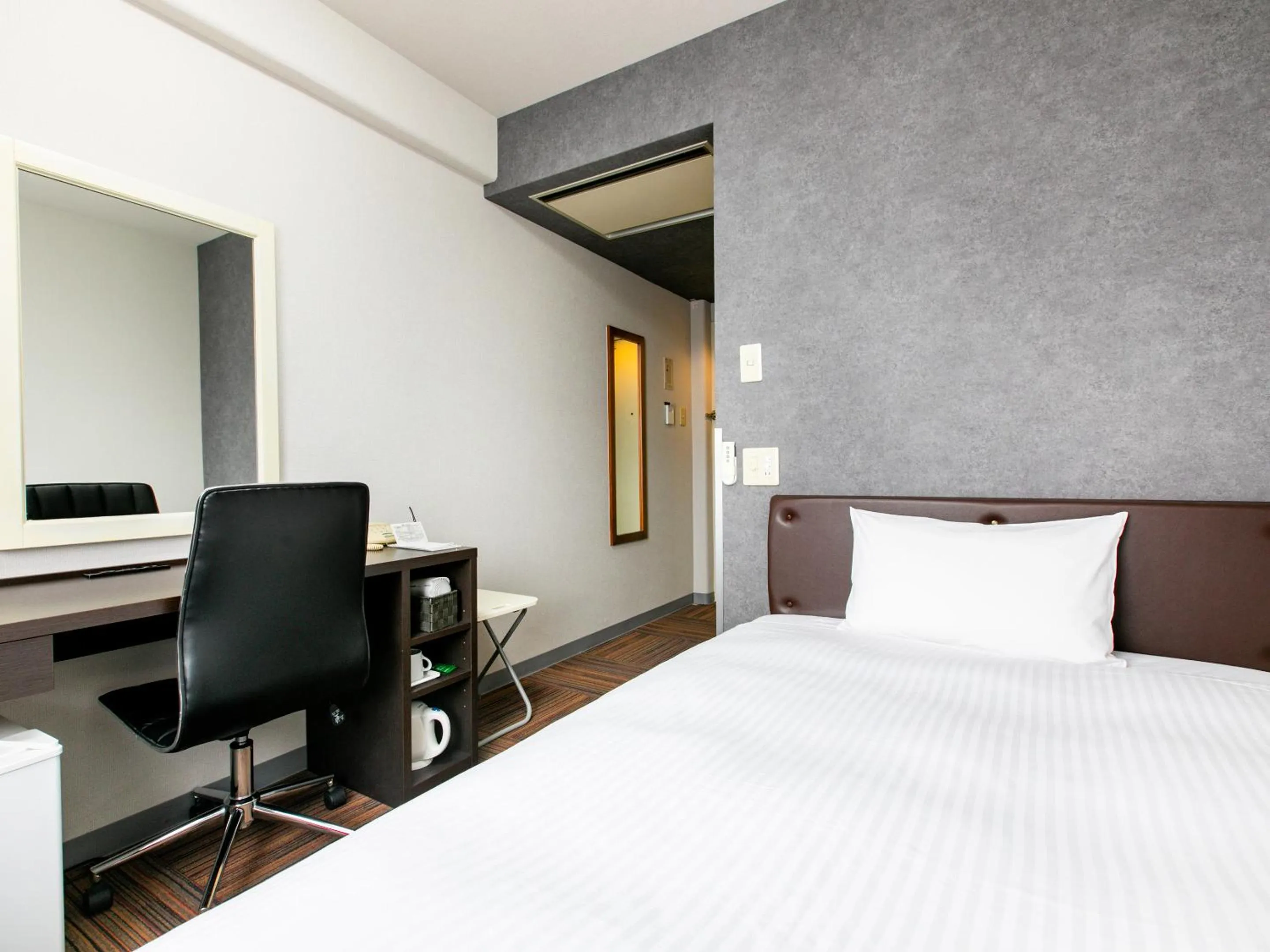 Bed in KOKO STAY Miyakonojo - formerly Hotel Wing International Miyakonojo