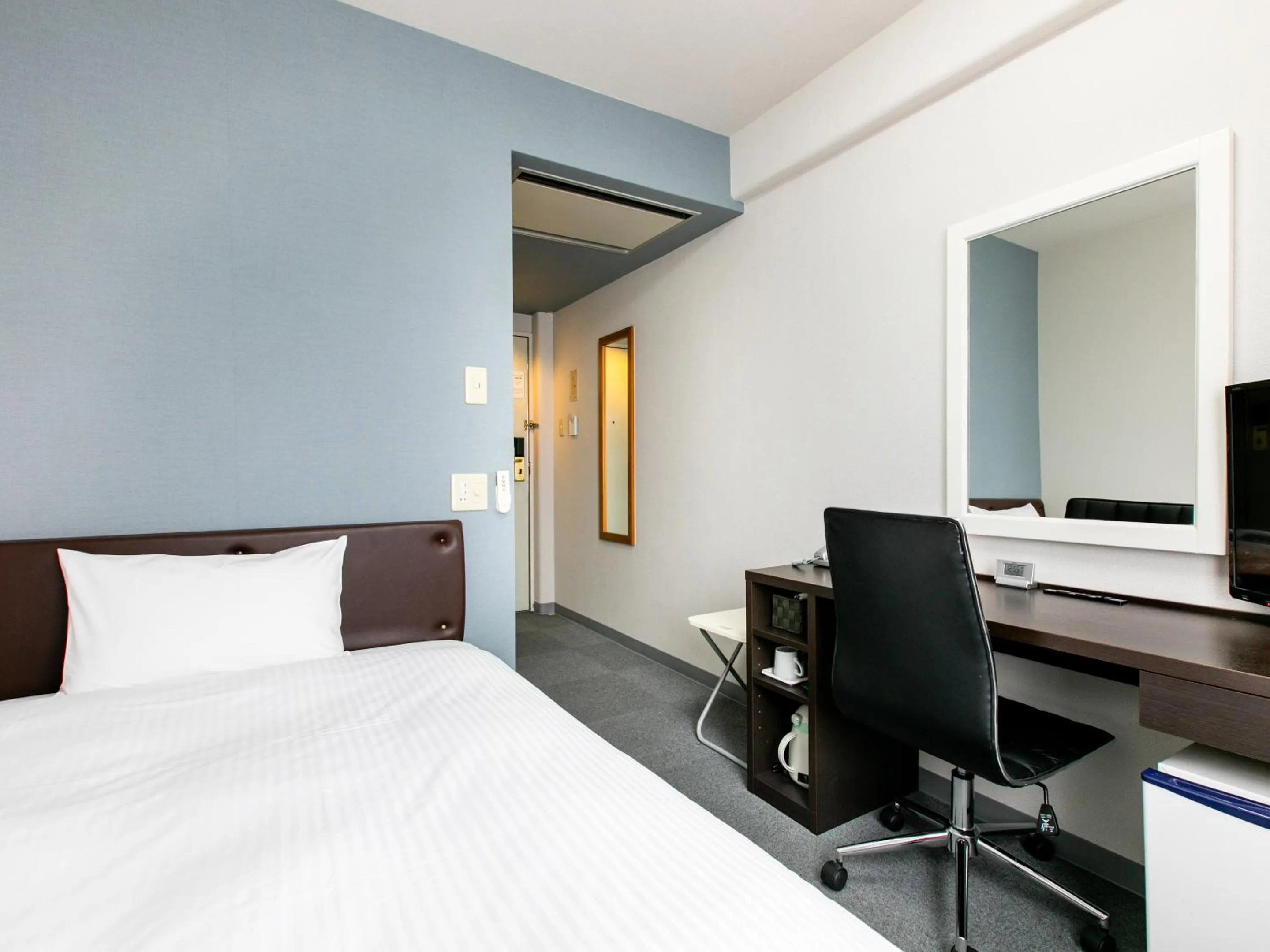 Bed in KOKO STAY Miyakonojo - formerly Hotel Wing International Miyakonojo