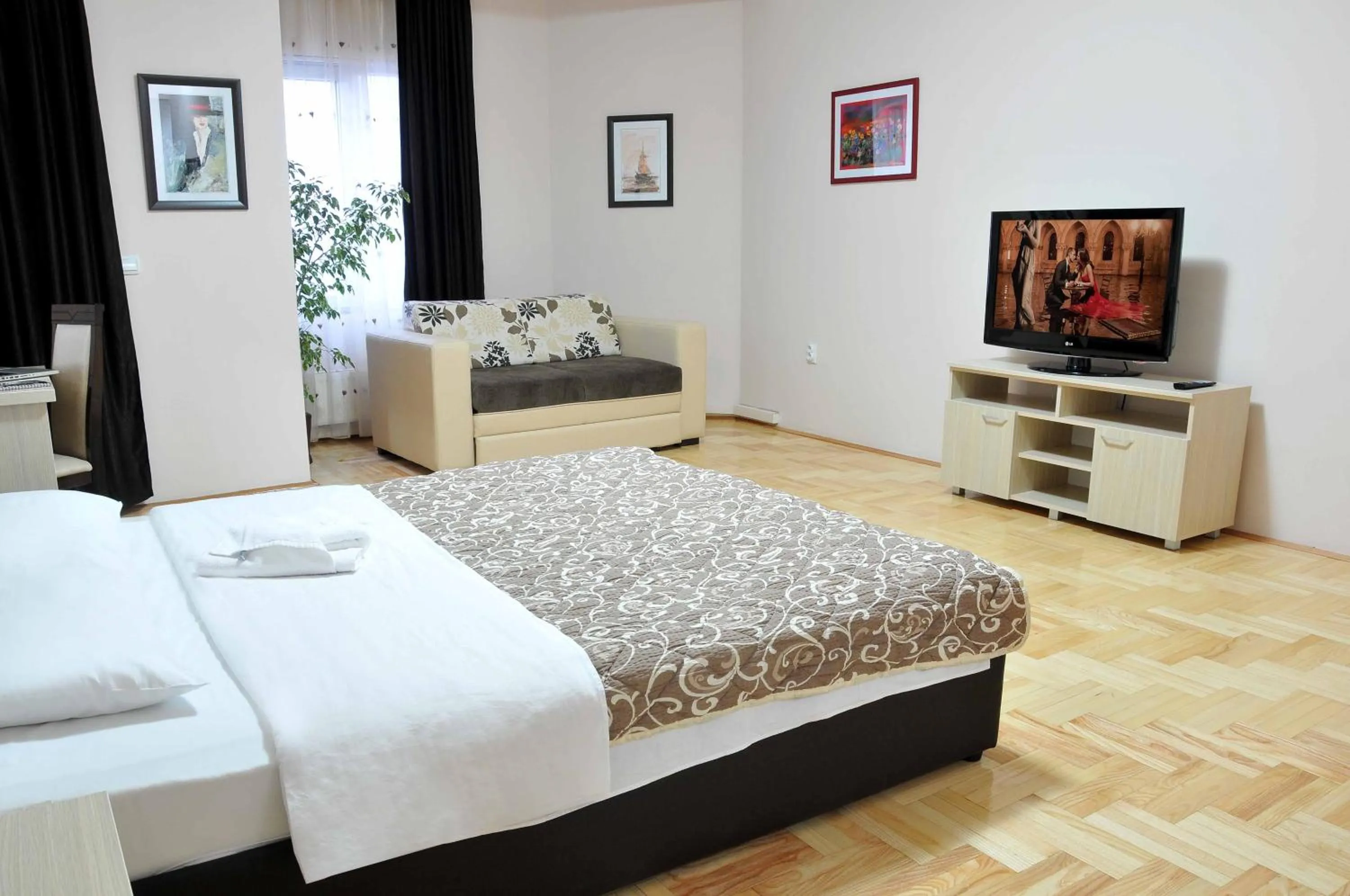 Bed in Garni Hotel Lotos