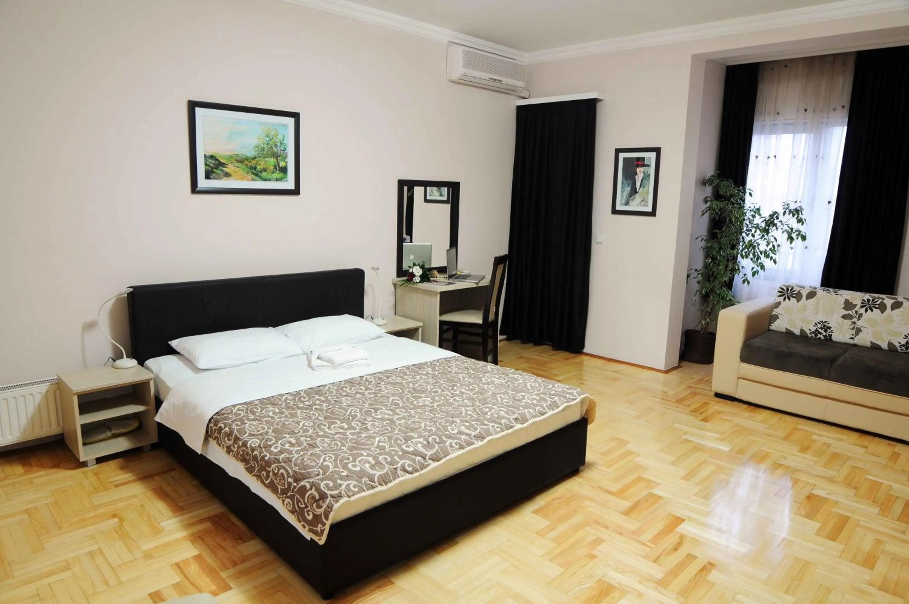 Bed in Garni Hotel Lotos