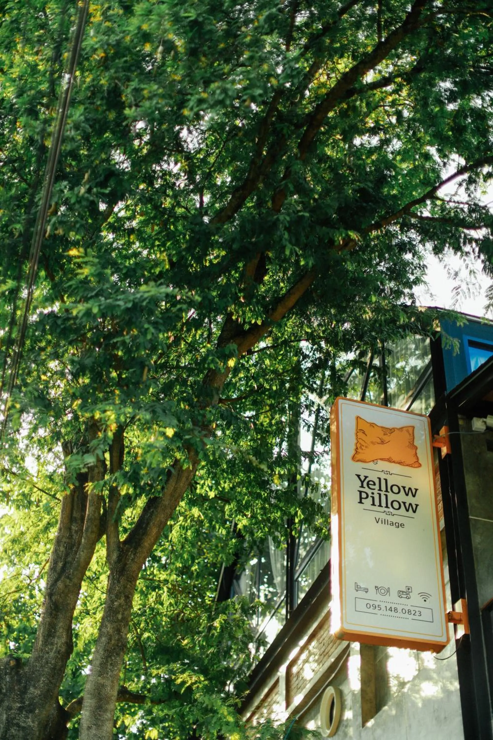 Property logo or sign in Yellow Pillow village