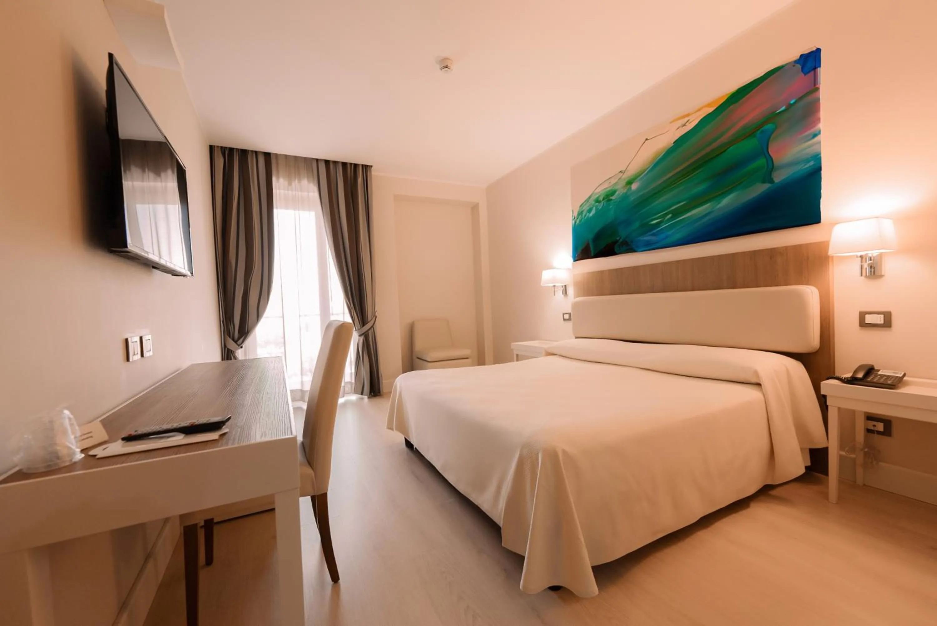 Bed in Hotel Mirasole International