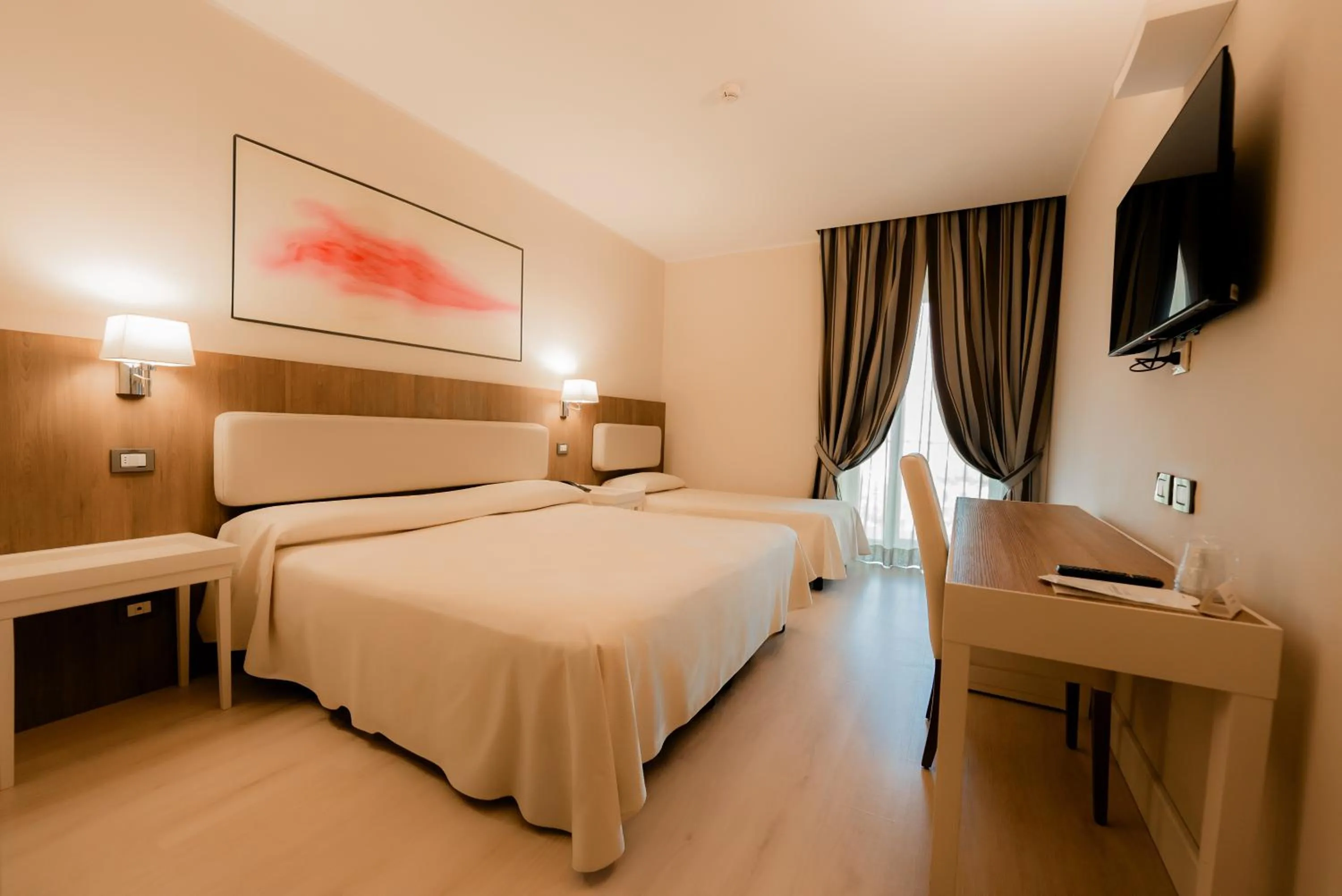 Bed in Hotel Mirasole International