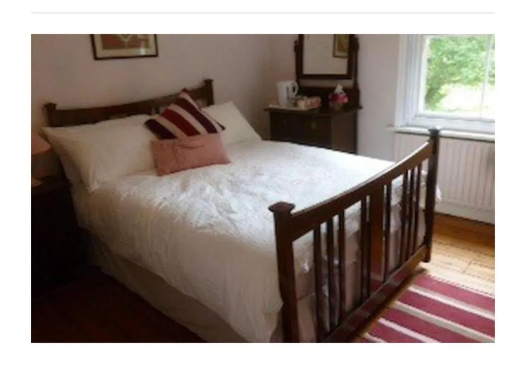 Bed in Court Barn Cottage B&B