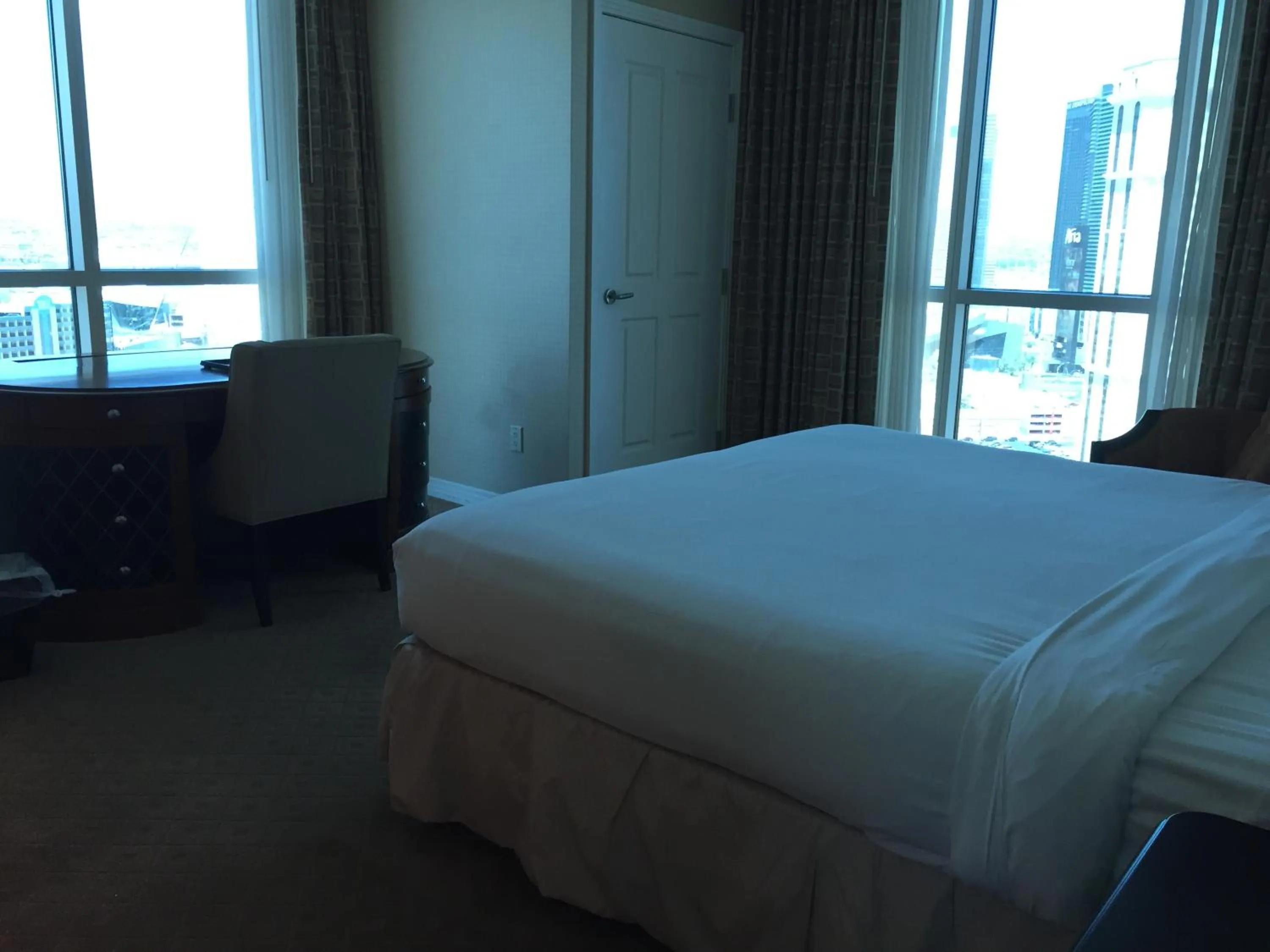 Bed in True 1BR Balcony Suite with Strip View at MGM Signature