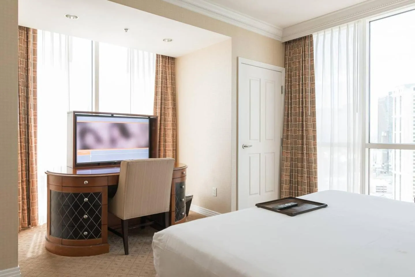 Bed in True 1BR Balcony Suite with Strip View at MGM Signature