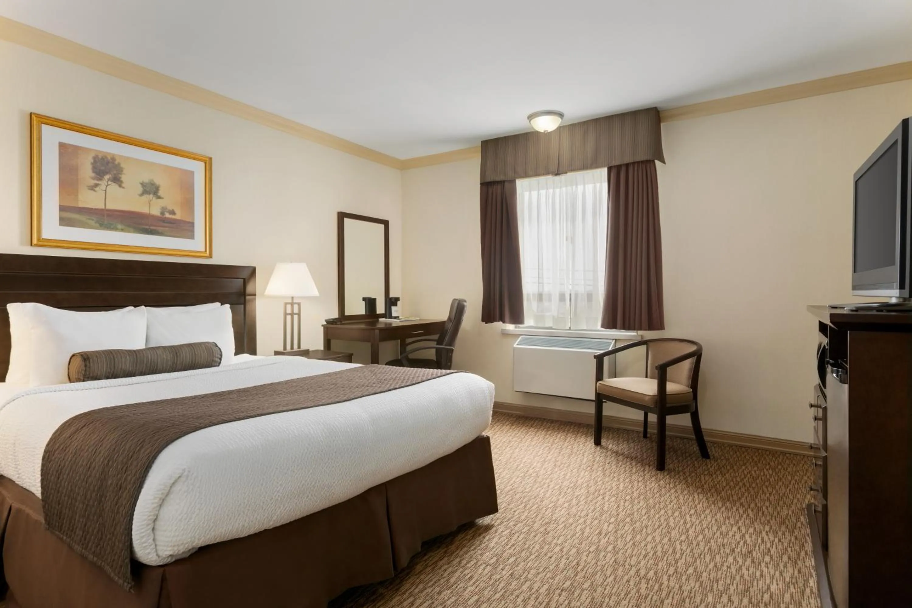 Photo of the whole room, Bed in Days Inn & Suites by Wyndham Sault Ste. Marie ON