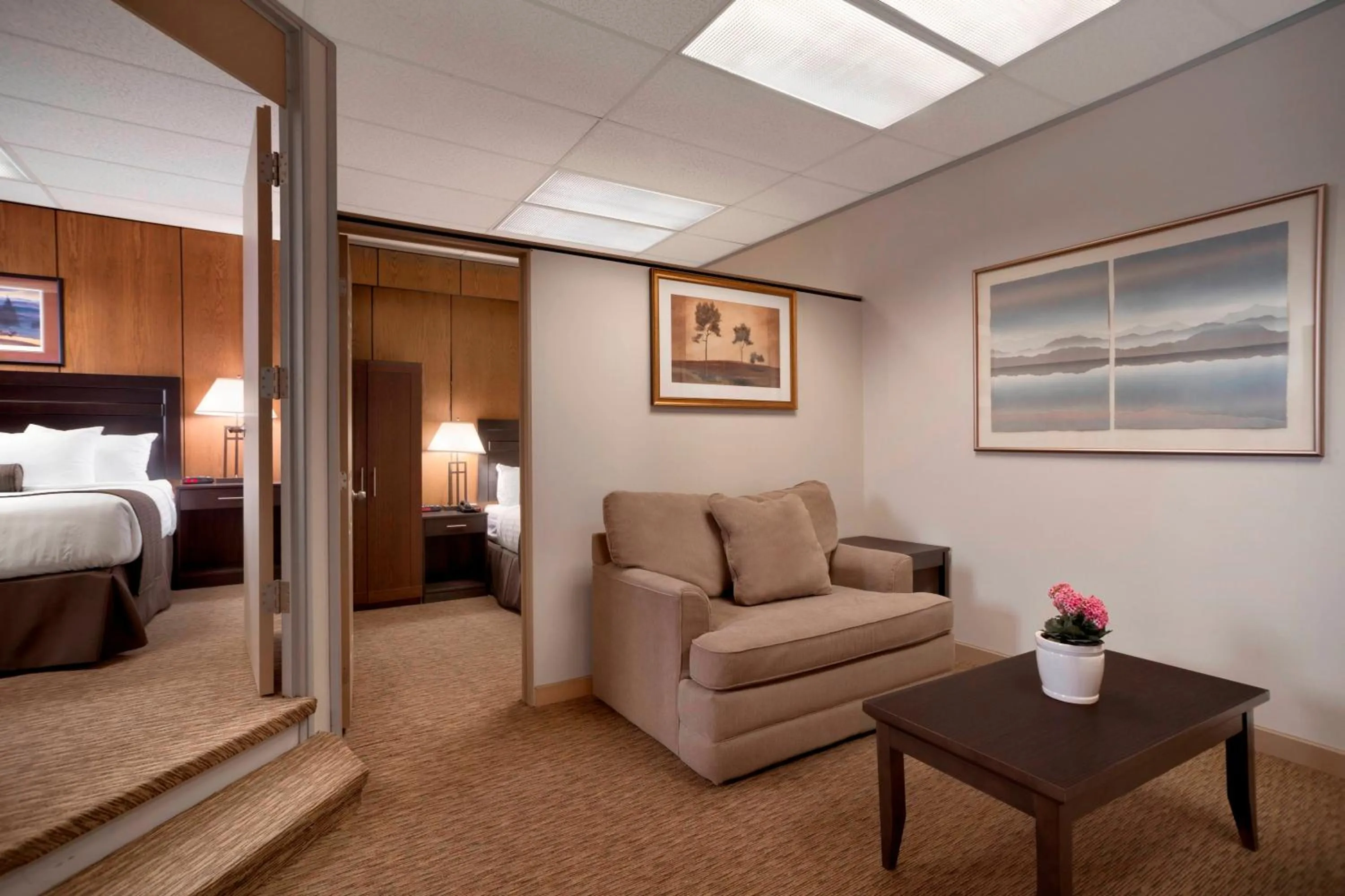 Living room, Bed in Days Inn & Suites by Wyndham Sault Ste. Marie ON