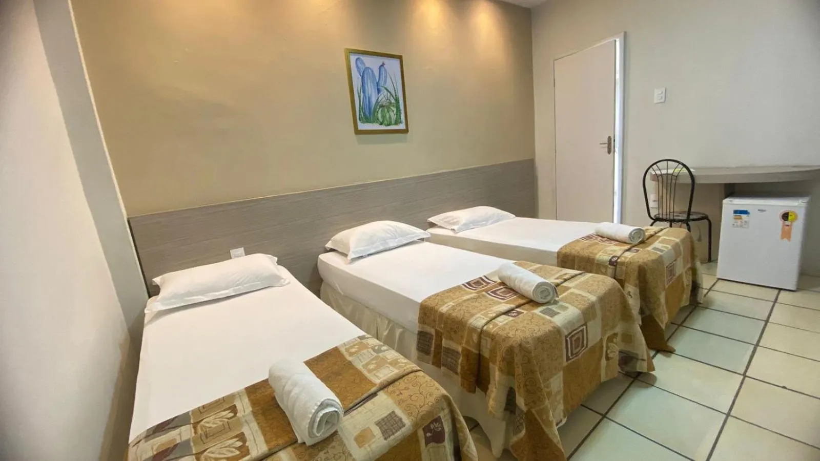 Bed in Center Plaza Hotel