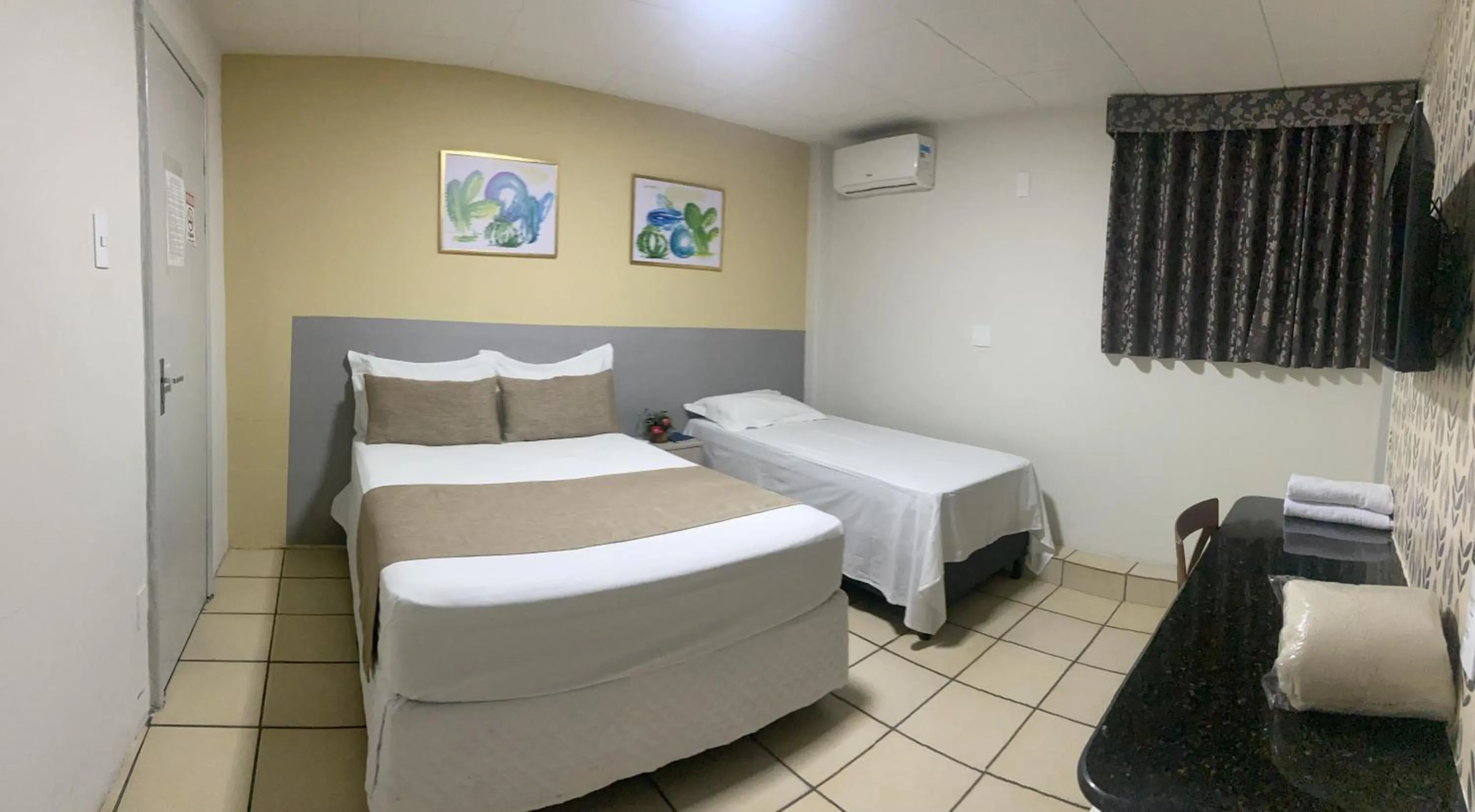 Bed in Center Plaza Hotel