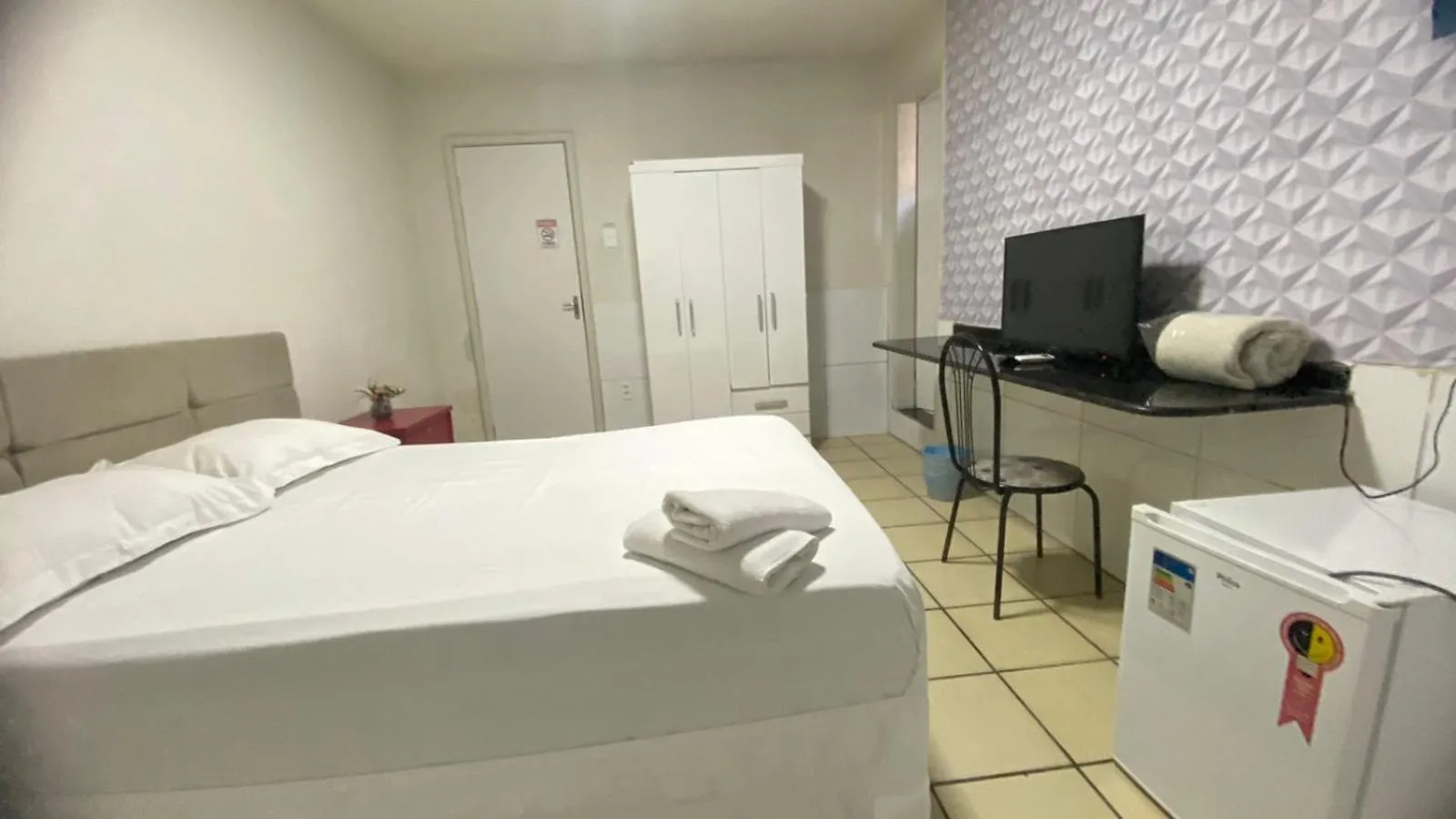 Bed in Center Plaza Hotel