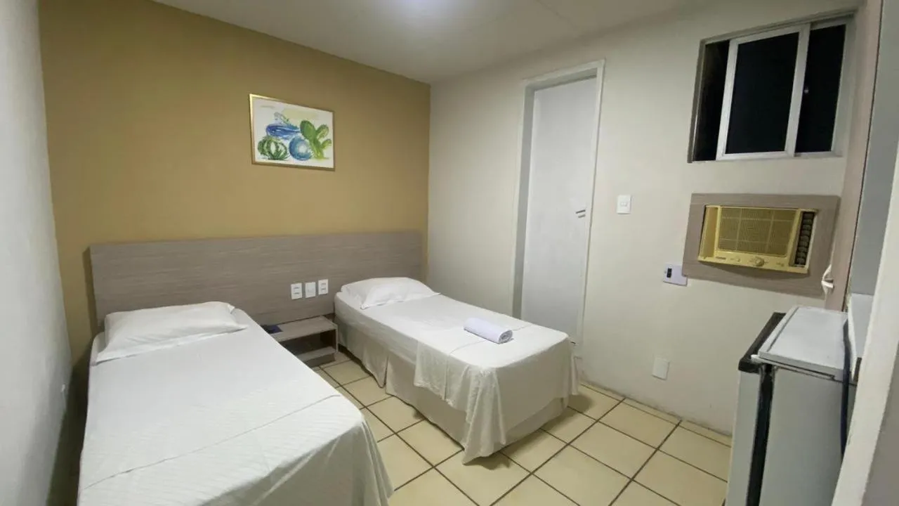 Bed in Center Plaza Hotel