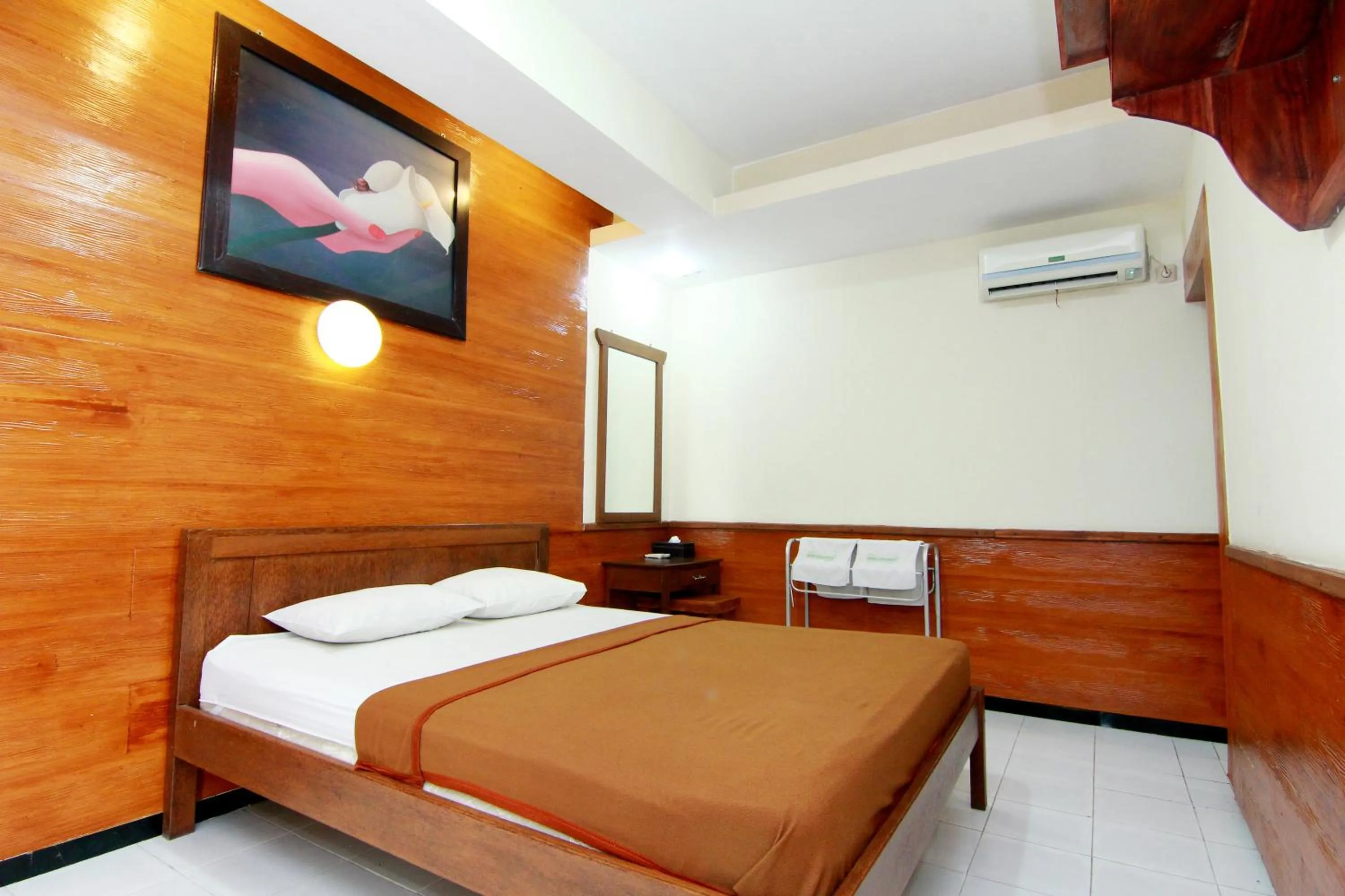 Bed in The Soemarsono Hotel