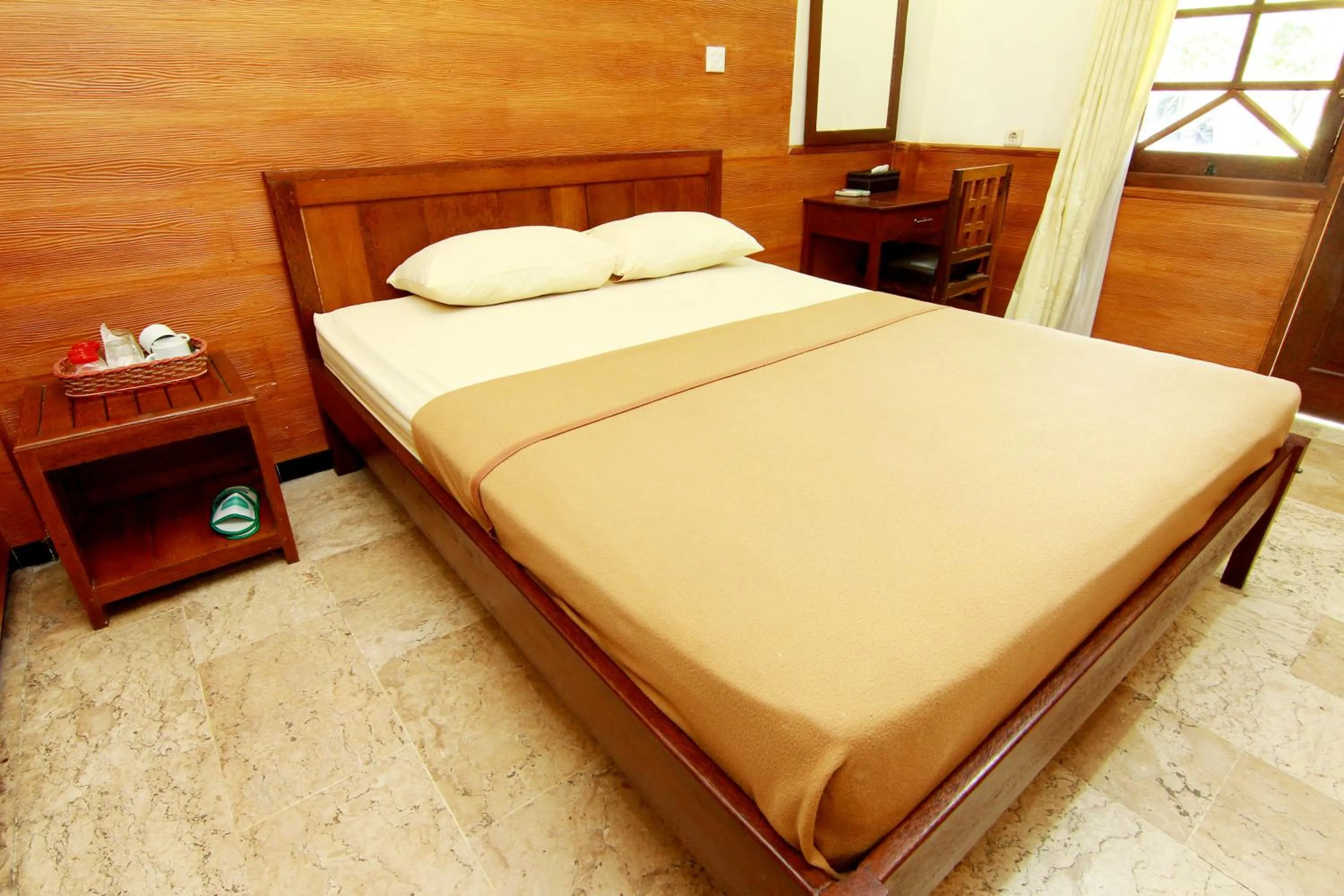 Bed in The Soemarsono Hotel