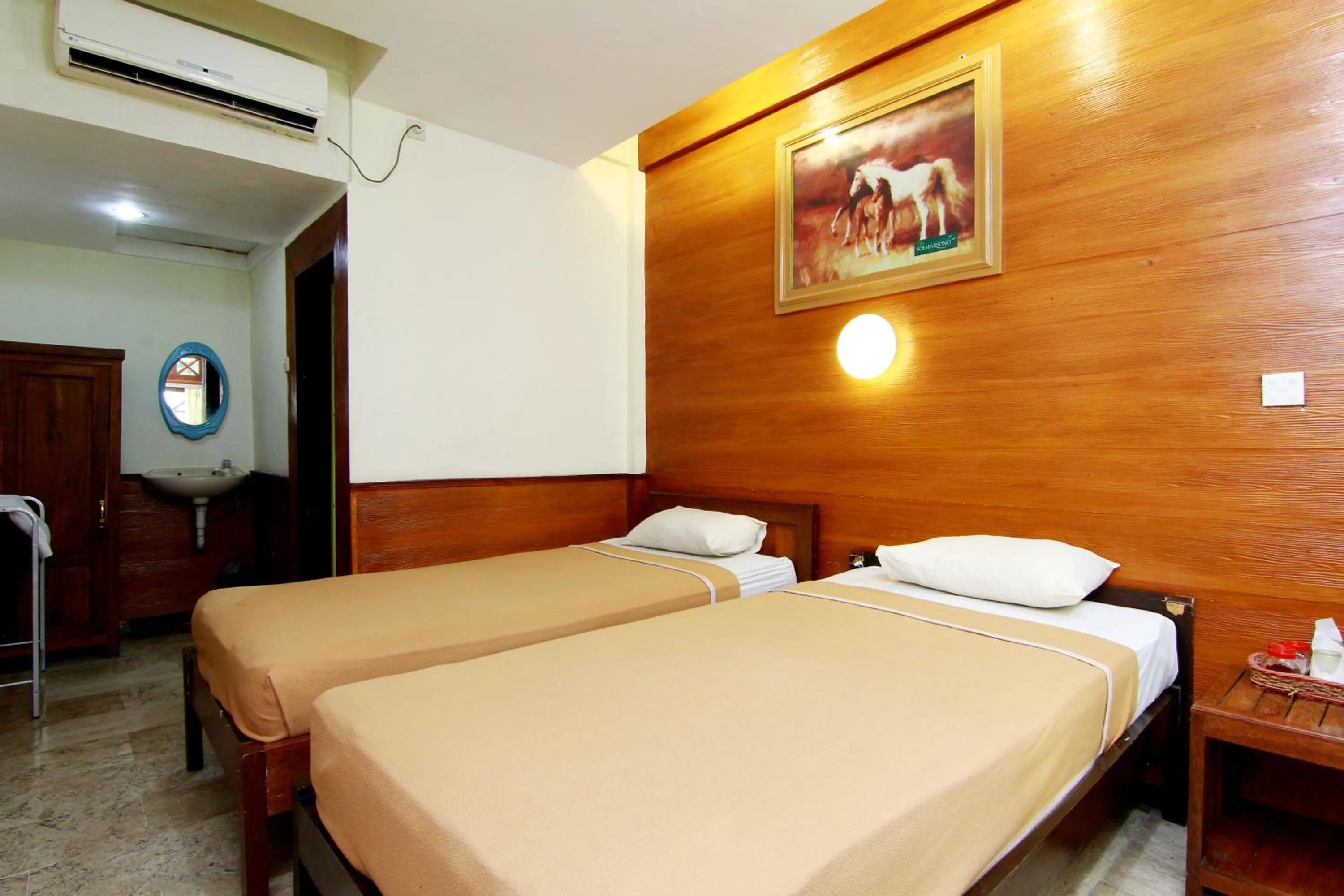 Bed in The Soemarsono Hotel