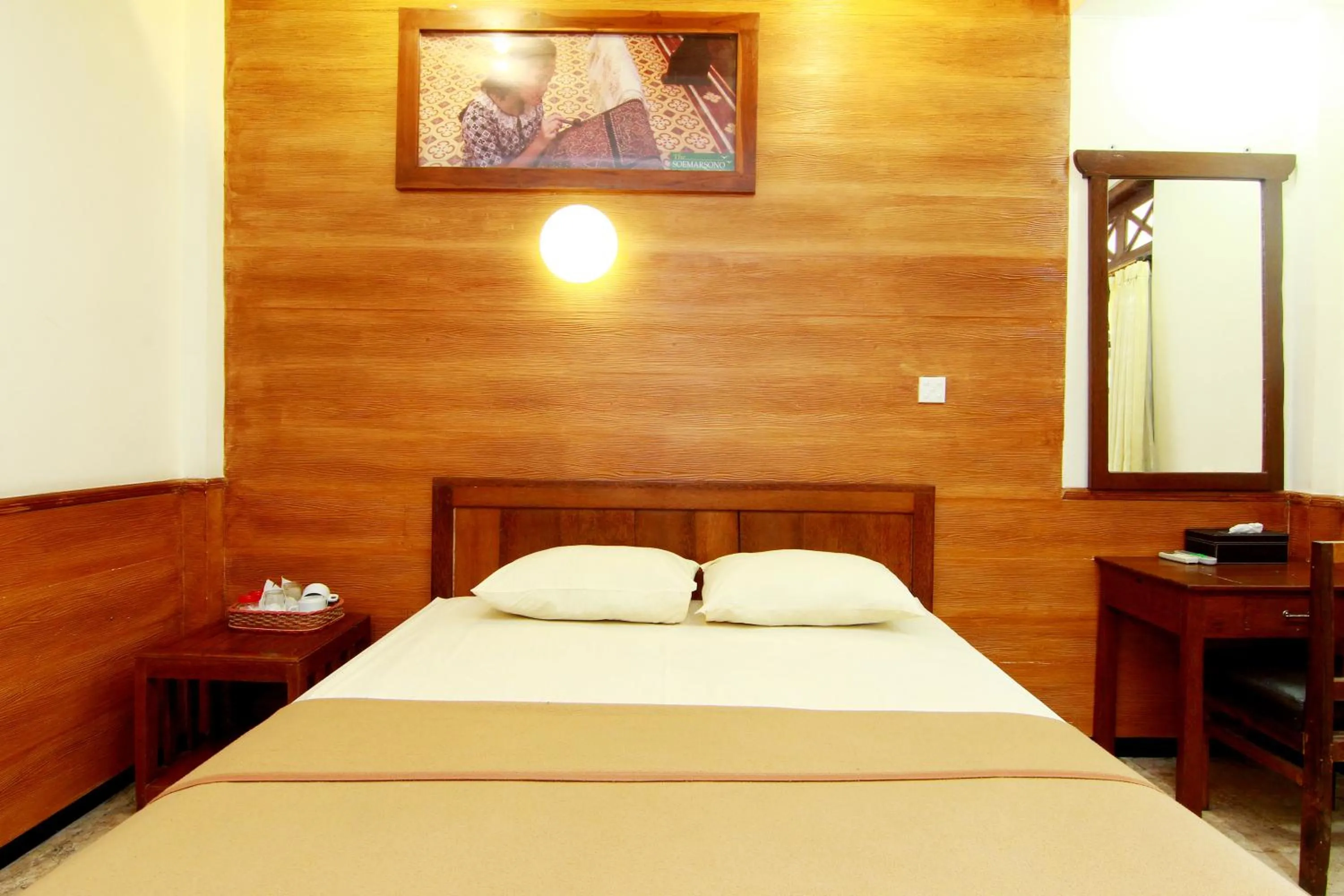Bed in The Soemarsono Hotel