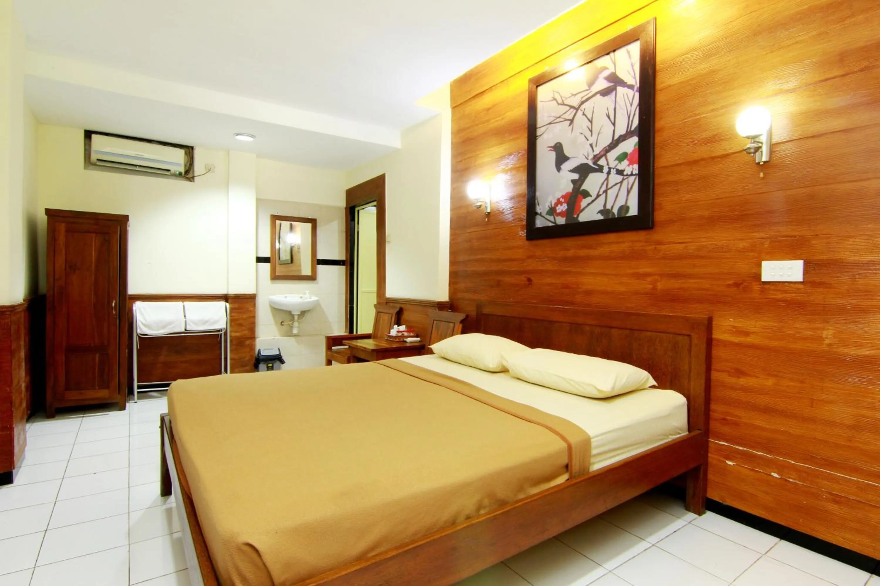 Bed in The Soemarsono Hotel