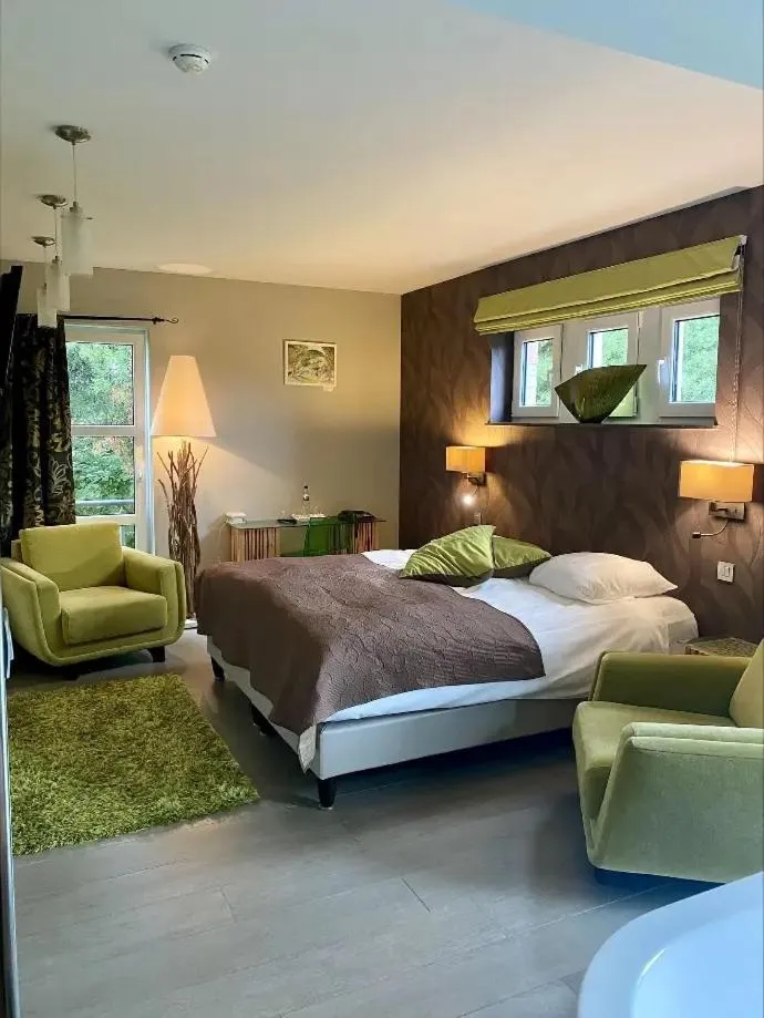 Bed in Hotel L'Ami du Chambertin