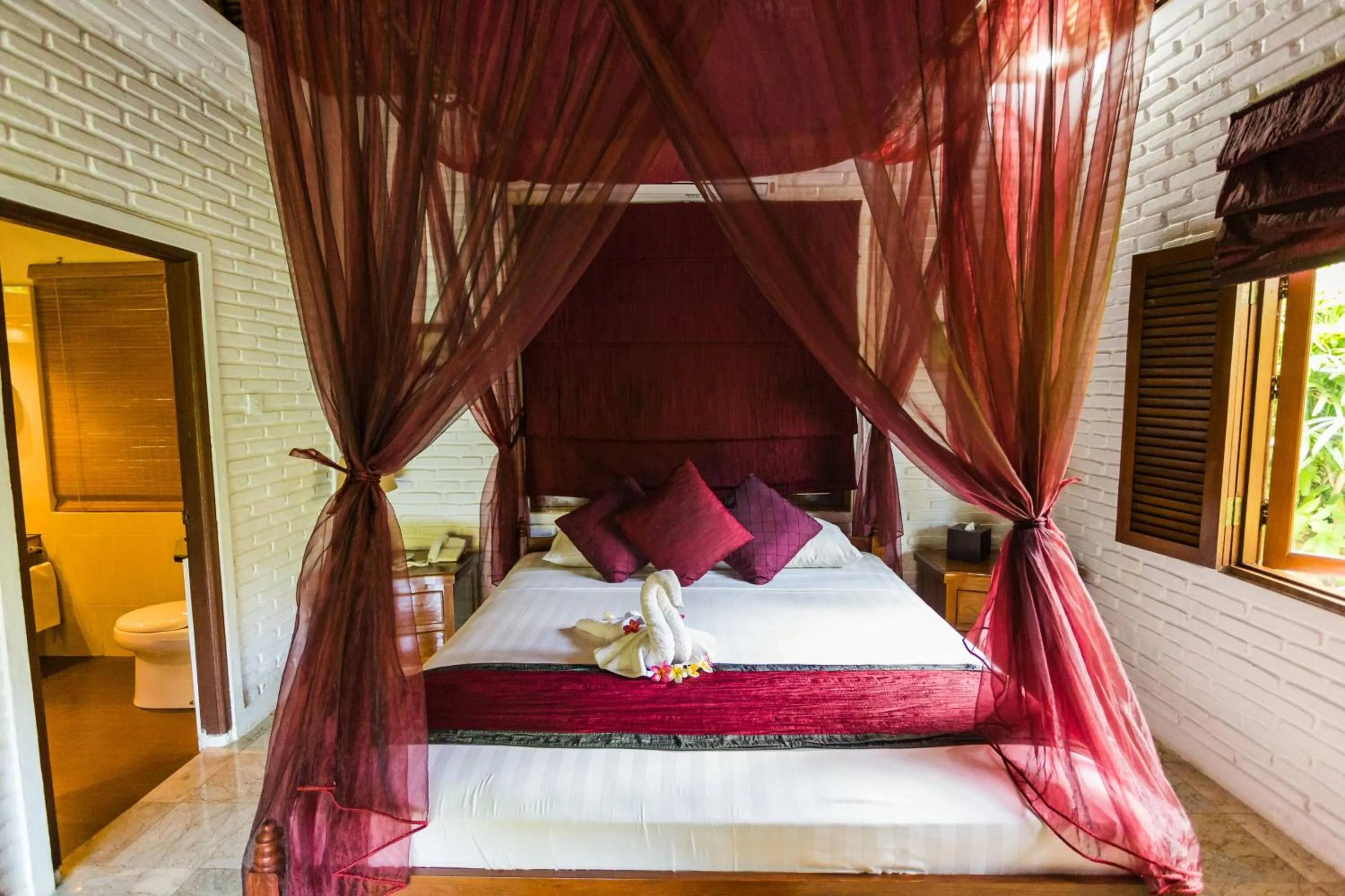 Bed in The Water Garden Hotel