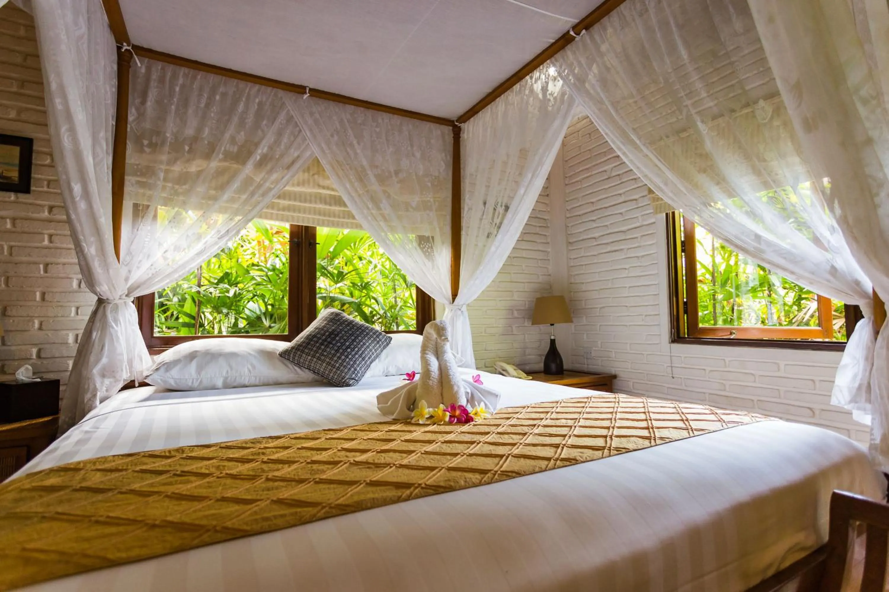 Bed in The Water Garden Hotel