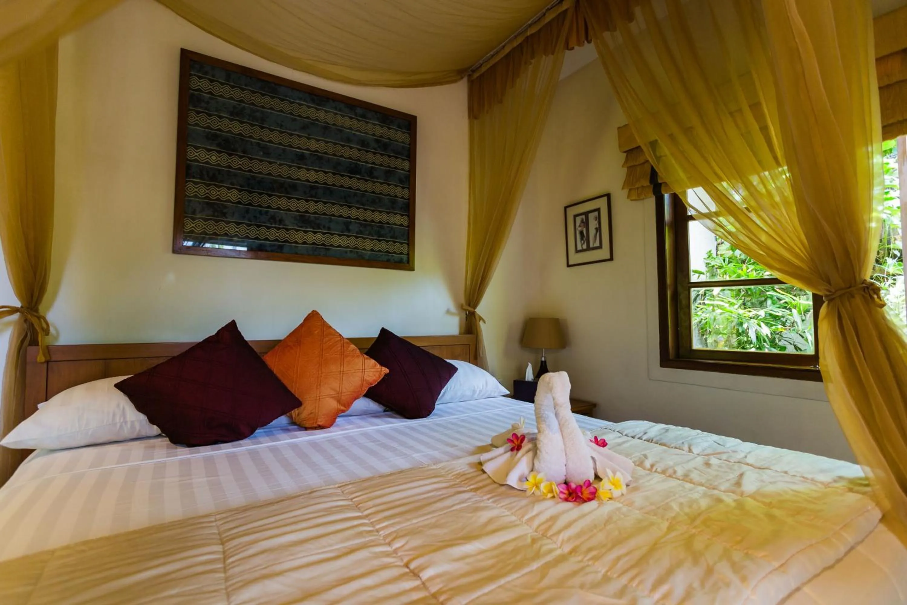 Bed in The Water Garden Hotel