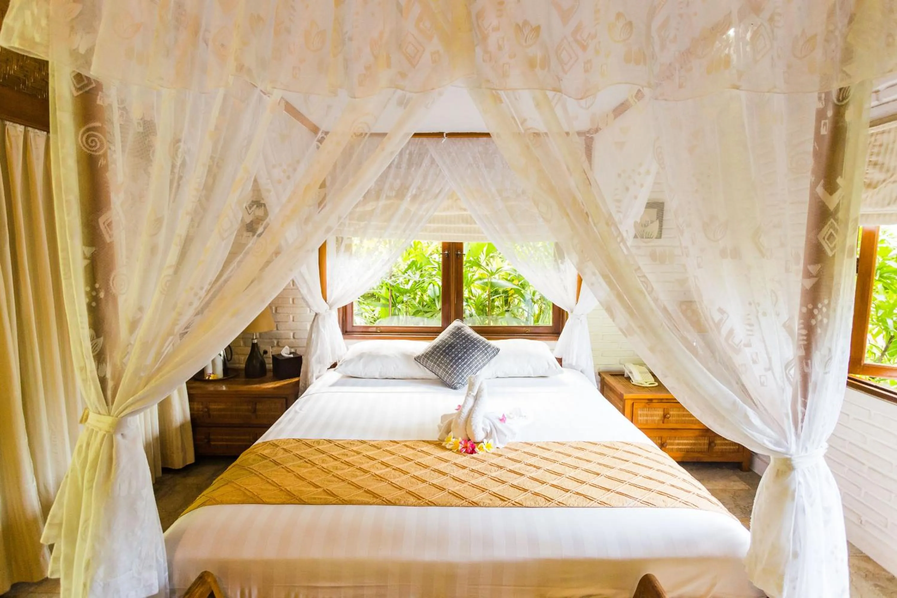 Bed in The Water Garden Hotel