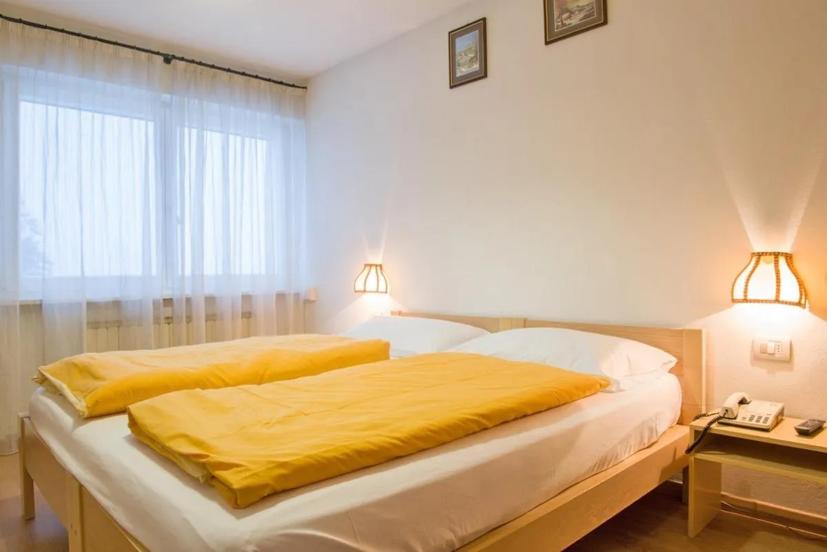 Bed in Hotel Regina Delle Dolomiti