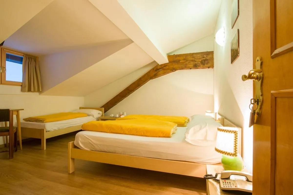 Photo of the whole room, Bed in Hotel Regina Delle Dolomiti