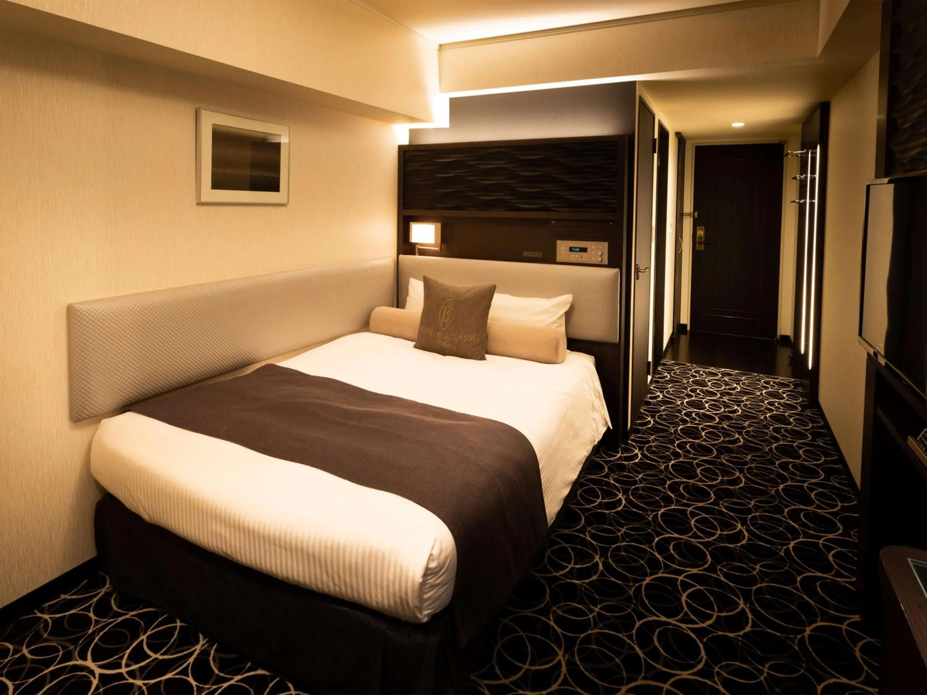 Bed in Hotel Bellclassic Tokyo