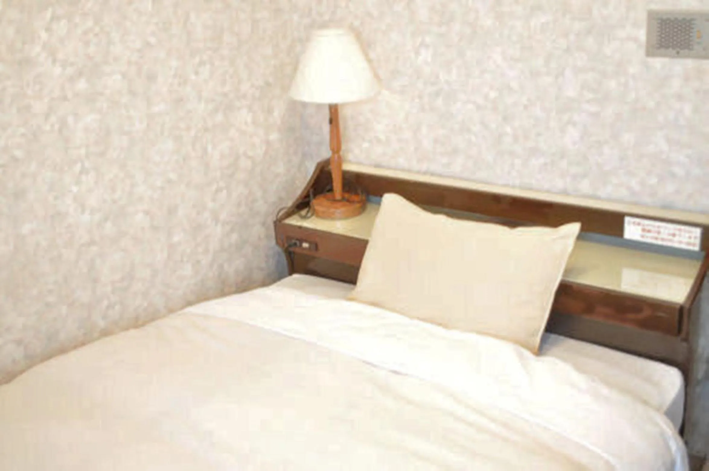 Bed in Green Hotel Rich Tokugawaen