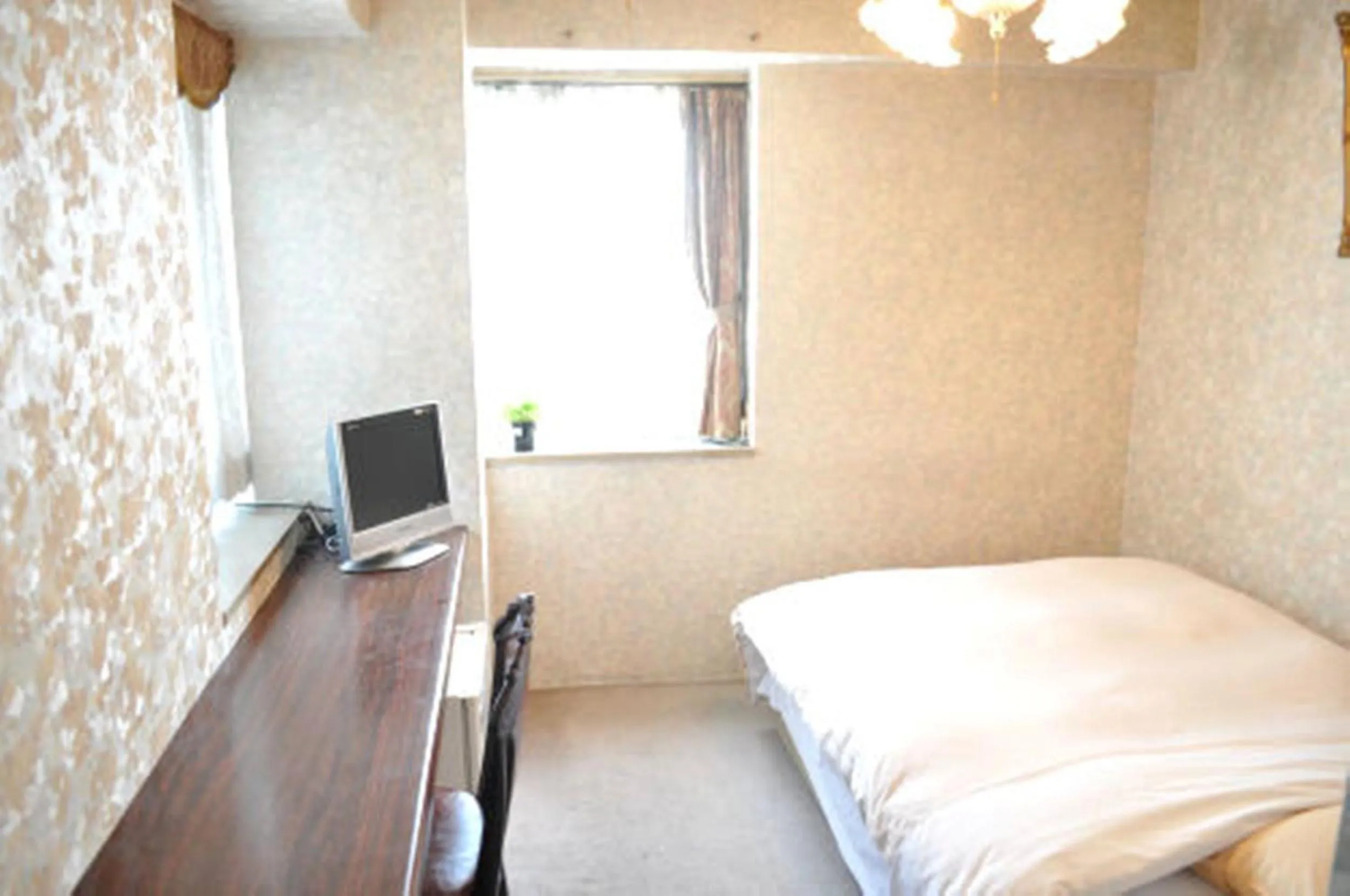 Bed in Green Hotel Rich Tokugawaen