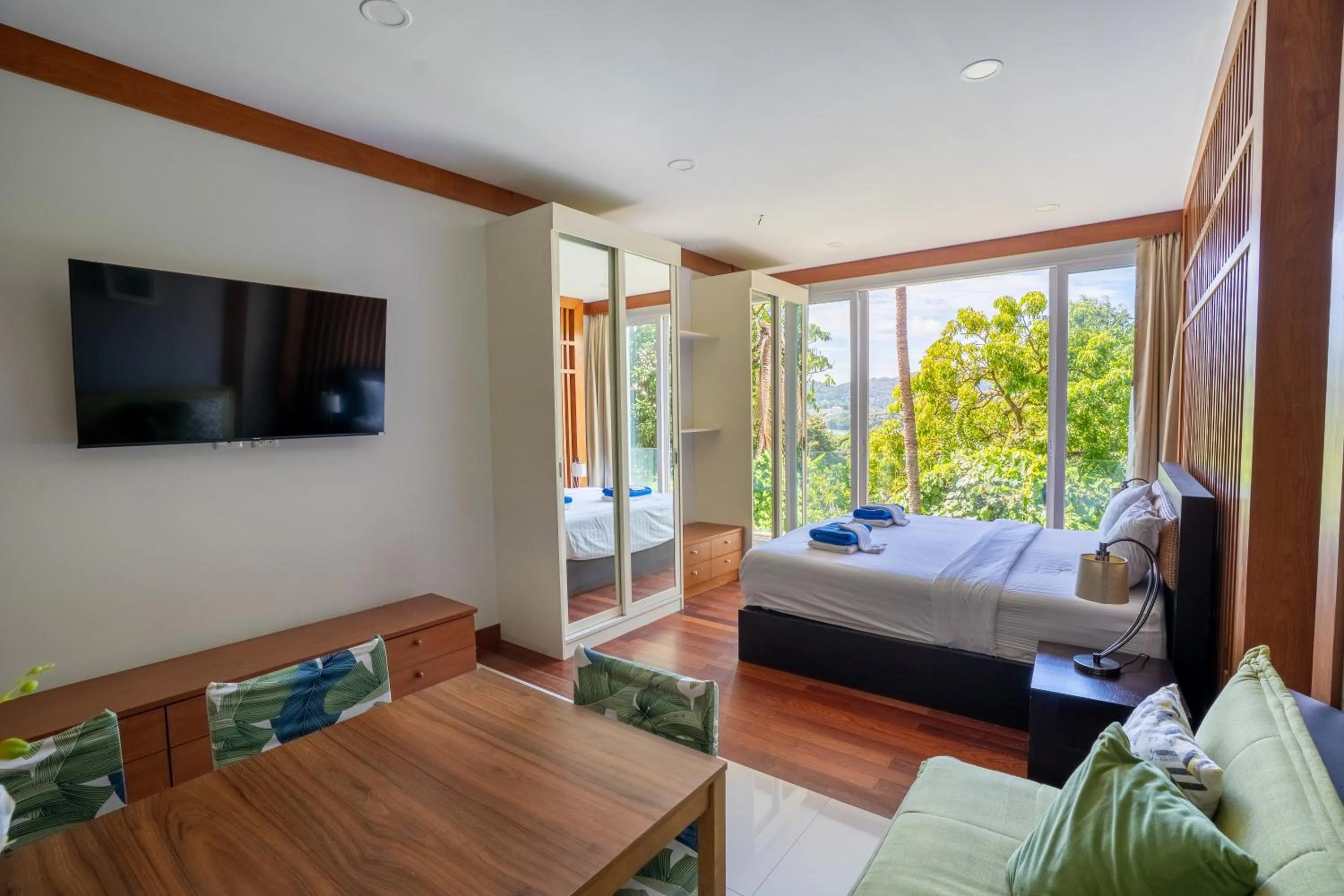 Communal lounge/ TV room, Bed in Q Kata Residence