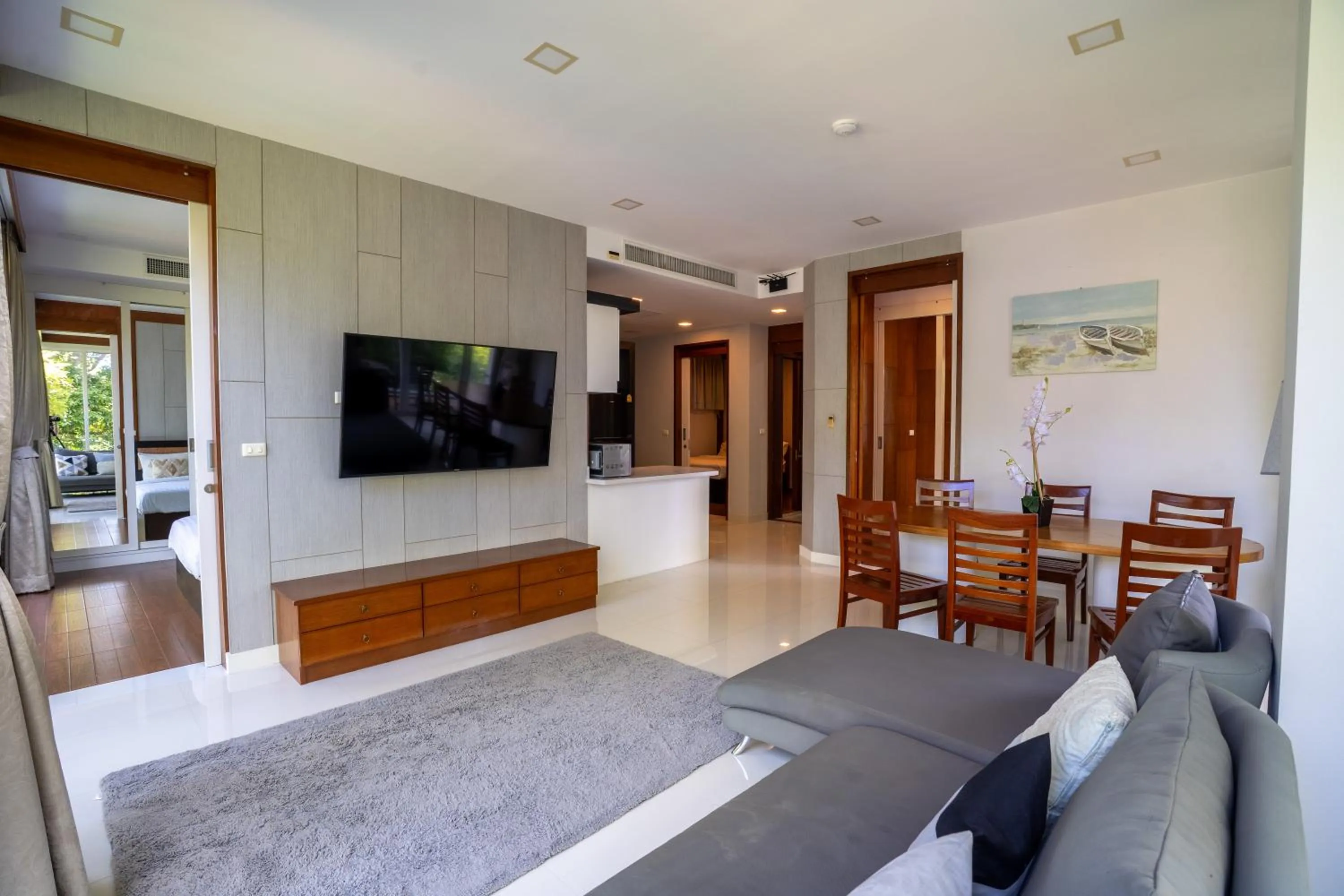 Communal lounge/ TV room, Bed in Q Kata Residence