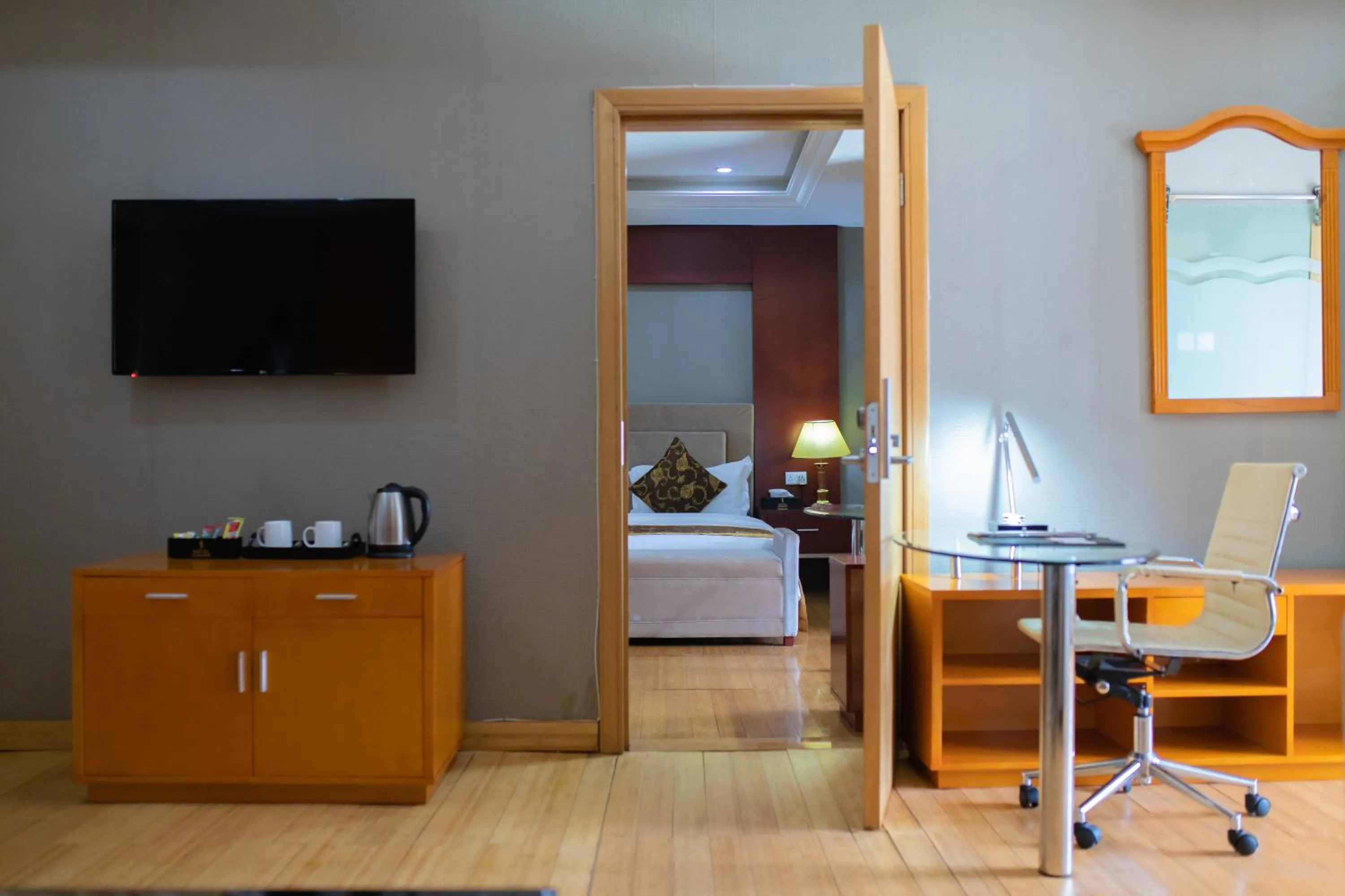 Communal lounge/ TV room, Bed in Hotel Sunshine Enugu