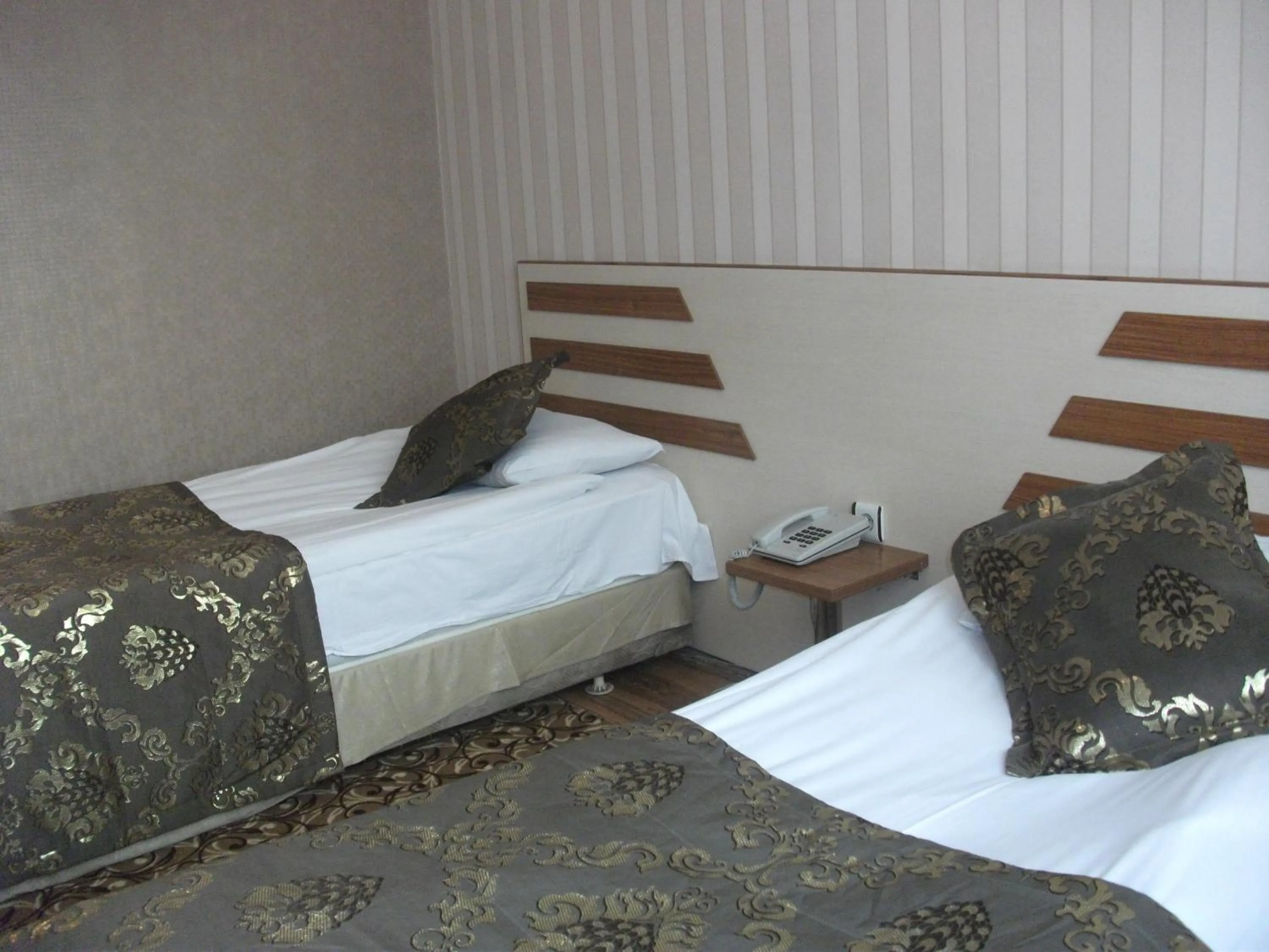 Bed in Tac Hotel
