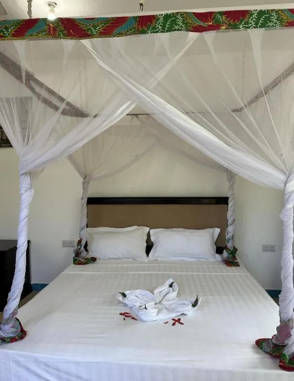 Bed in Coconut Tree Village Beach Resort