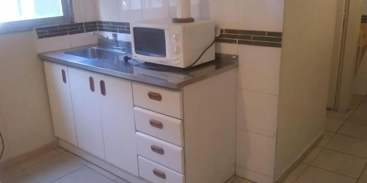 Communal kitchen in Apart Hotel Maue