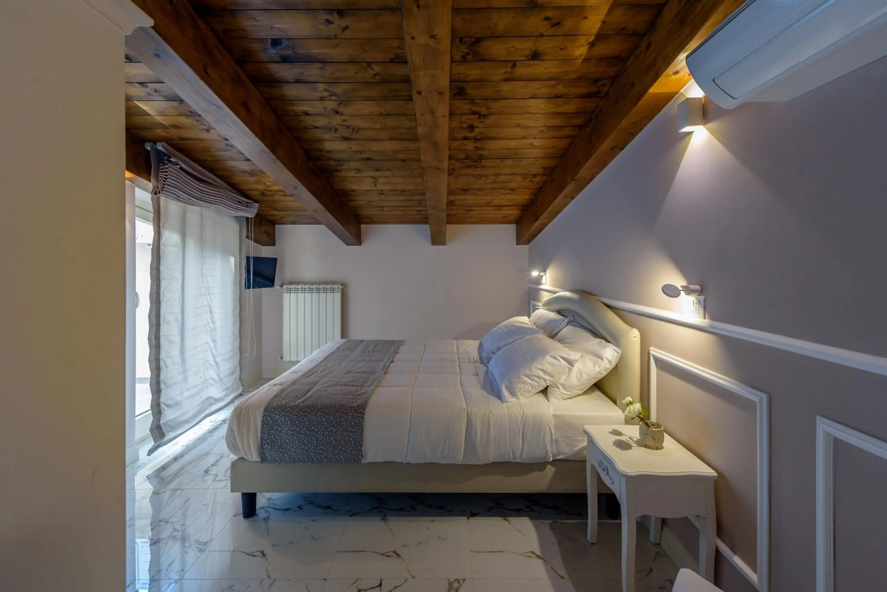 Bed in Marie Claire Apartments & Spa