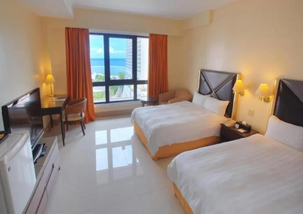 Bed in Royal Orchid Hotel Guam